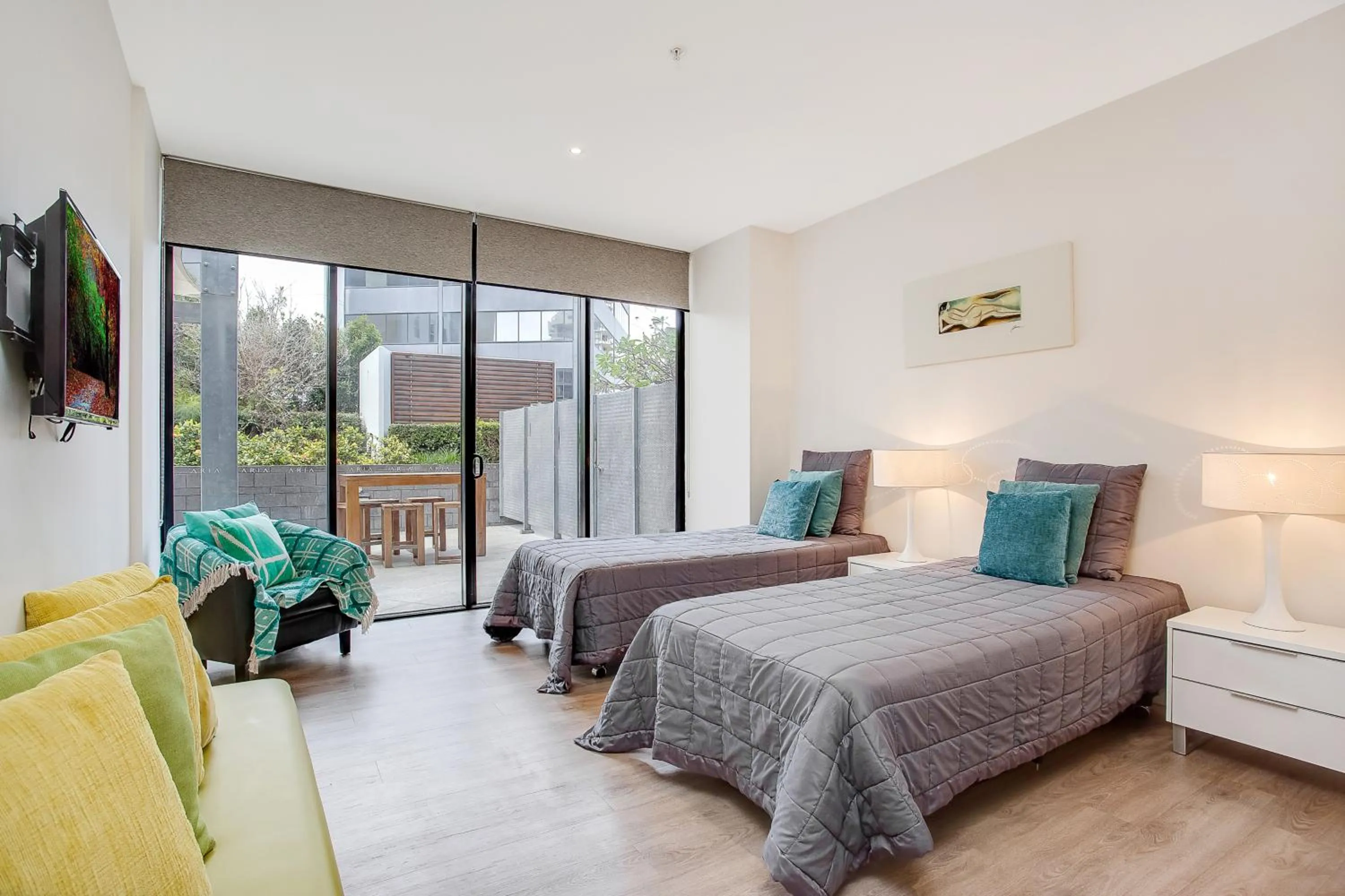 Bed in Aria Apartments