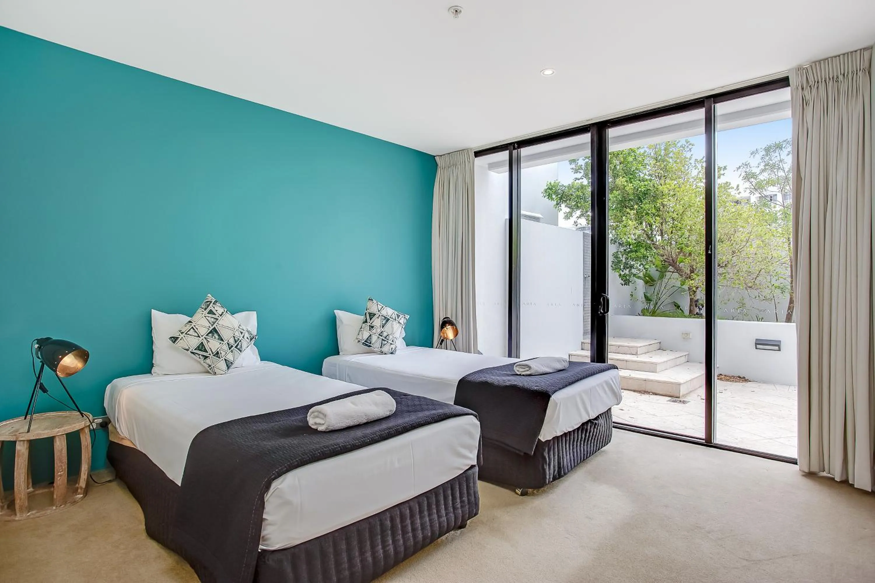 Bed in Aria Apartments