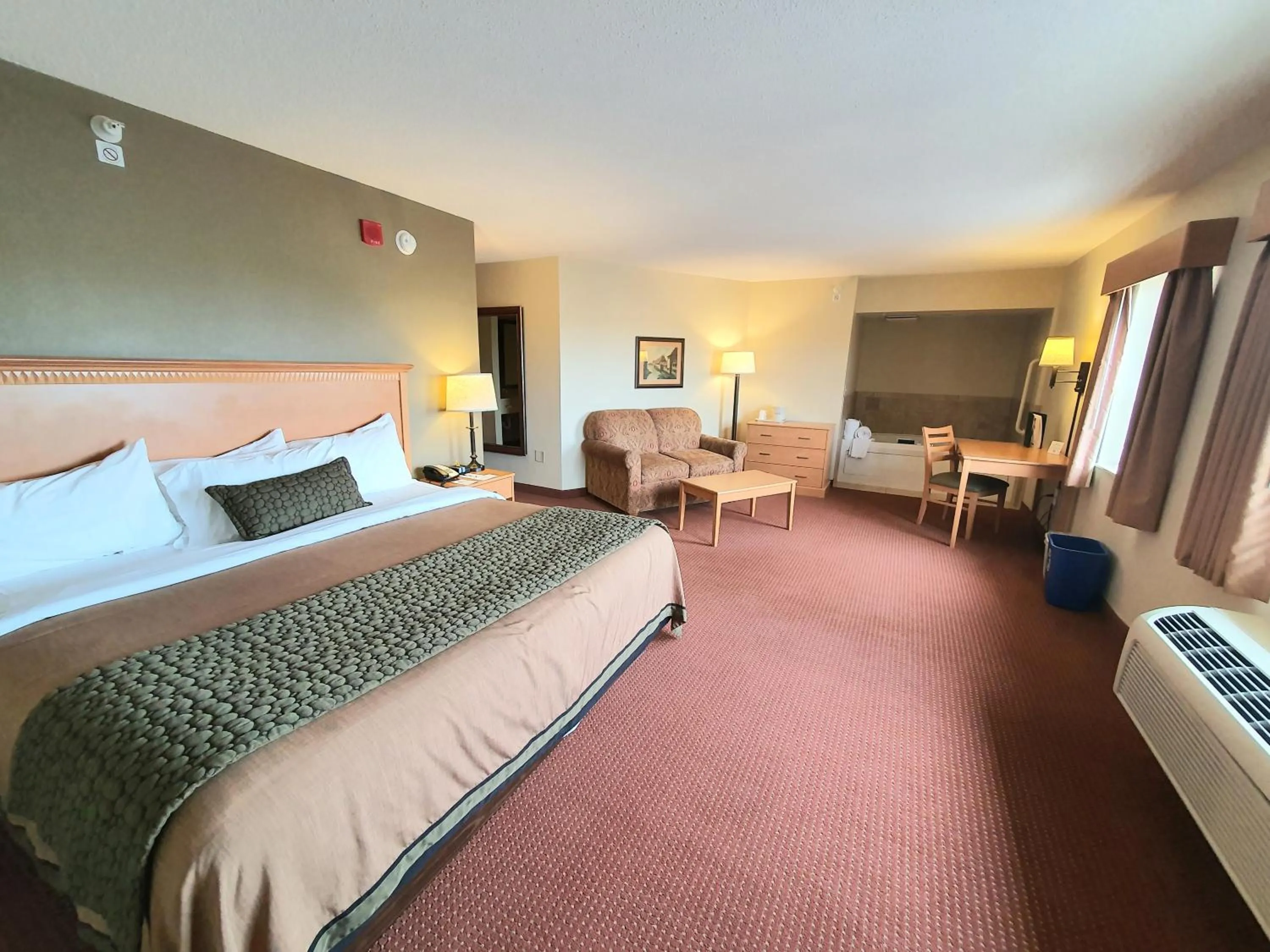 Bed in AmeriVu Inn and Suites - Waconia