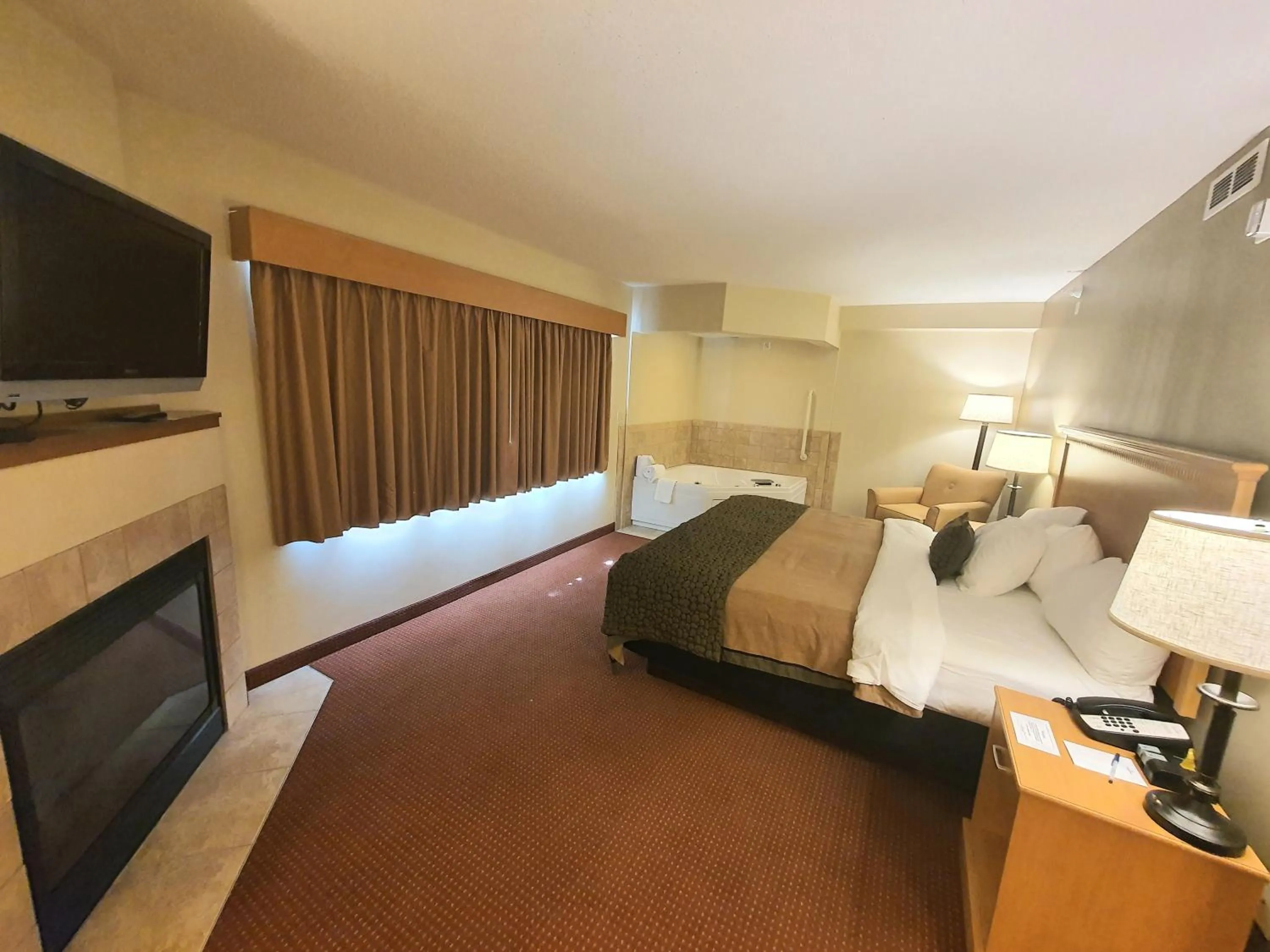 Bed in AmeriVu Inn and Suites - Waconia