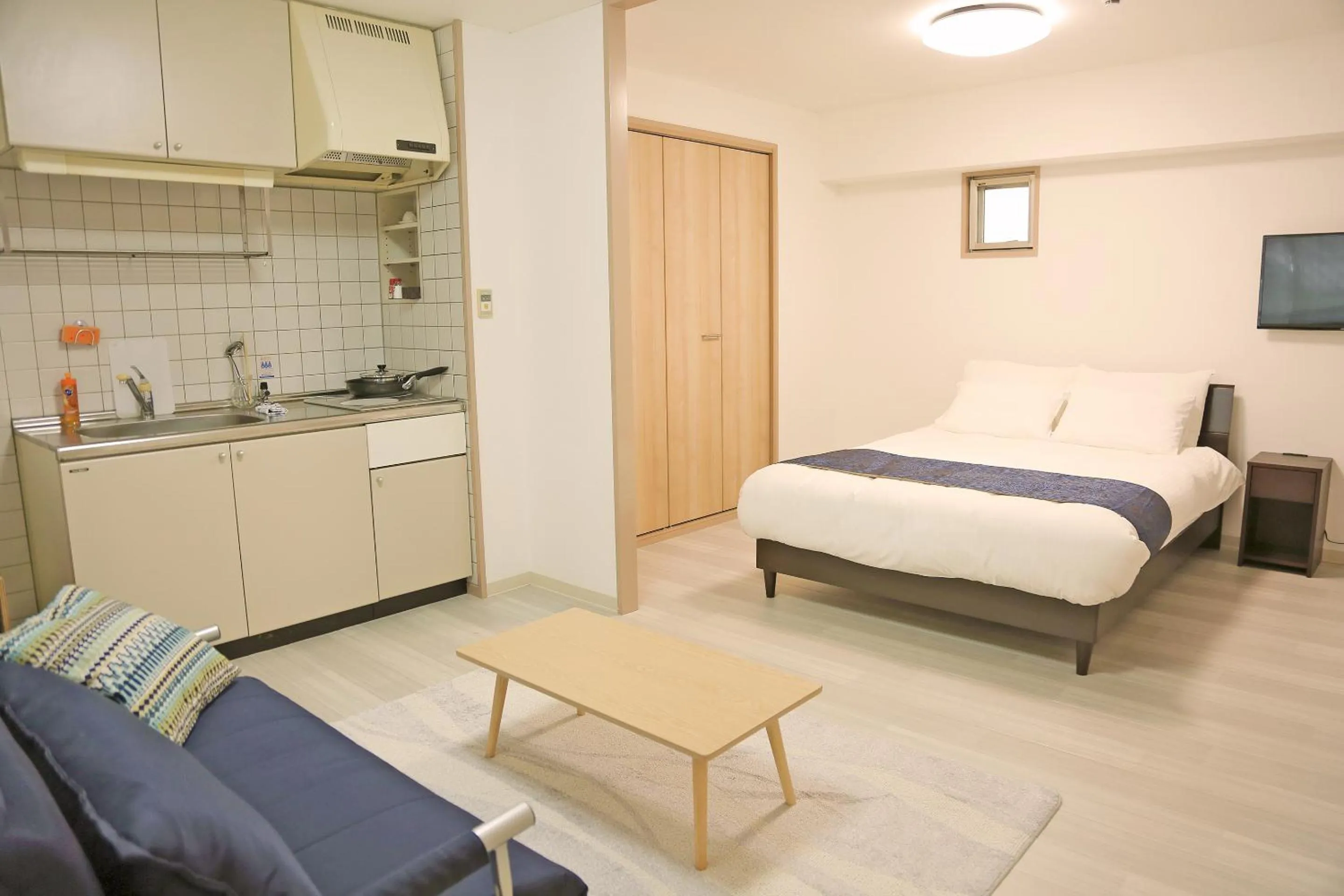Kitchen or kitchenette, Bed in Apartment HOTEL KIRO Kyoto STATION