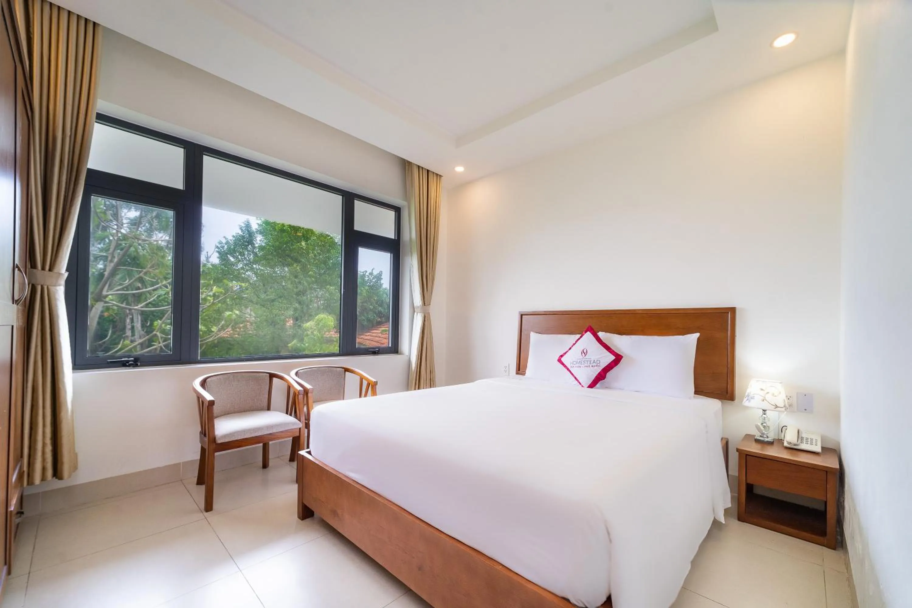 Bed in Homestead Seaview Phu Quoc Hotel