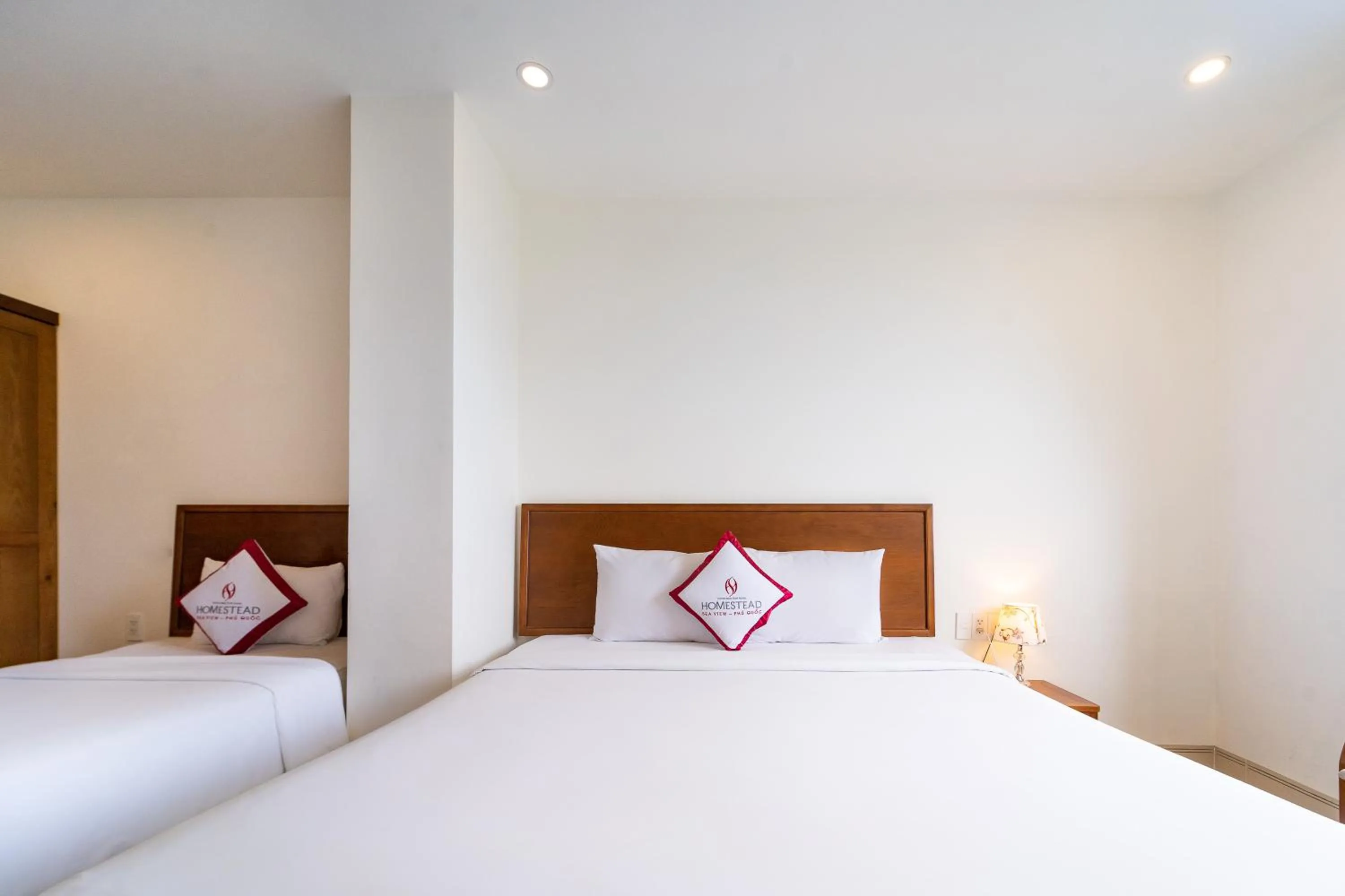 Bed in Homestead Seaview Phu Quoc Hotel