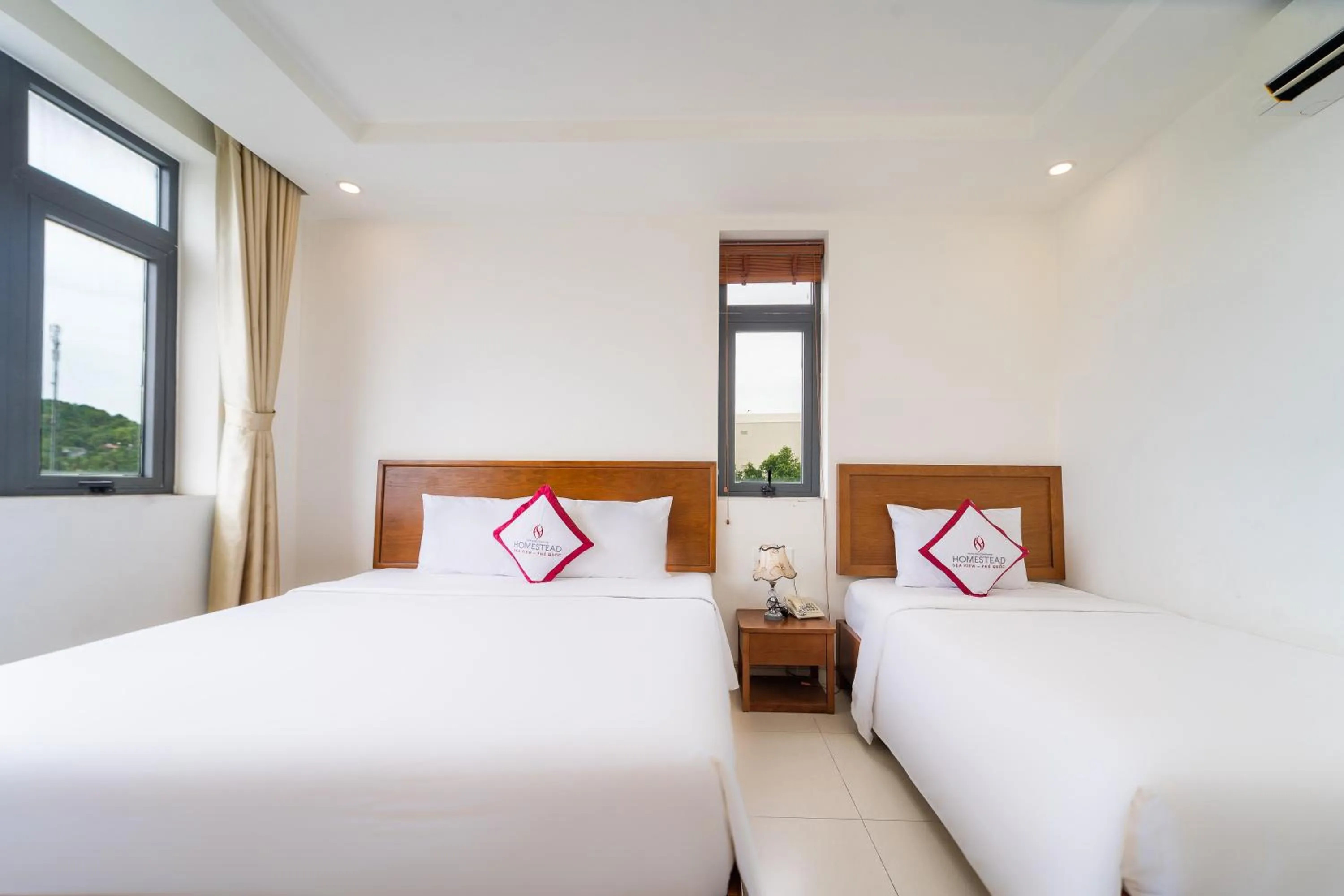 Bed in Homestead Seaview Phu Quoc Hotel