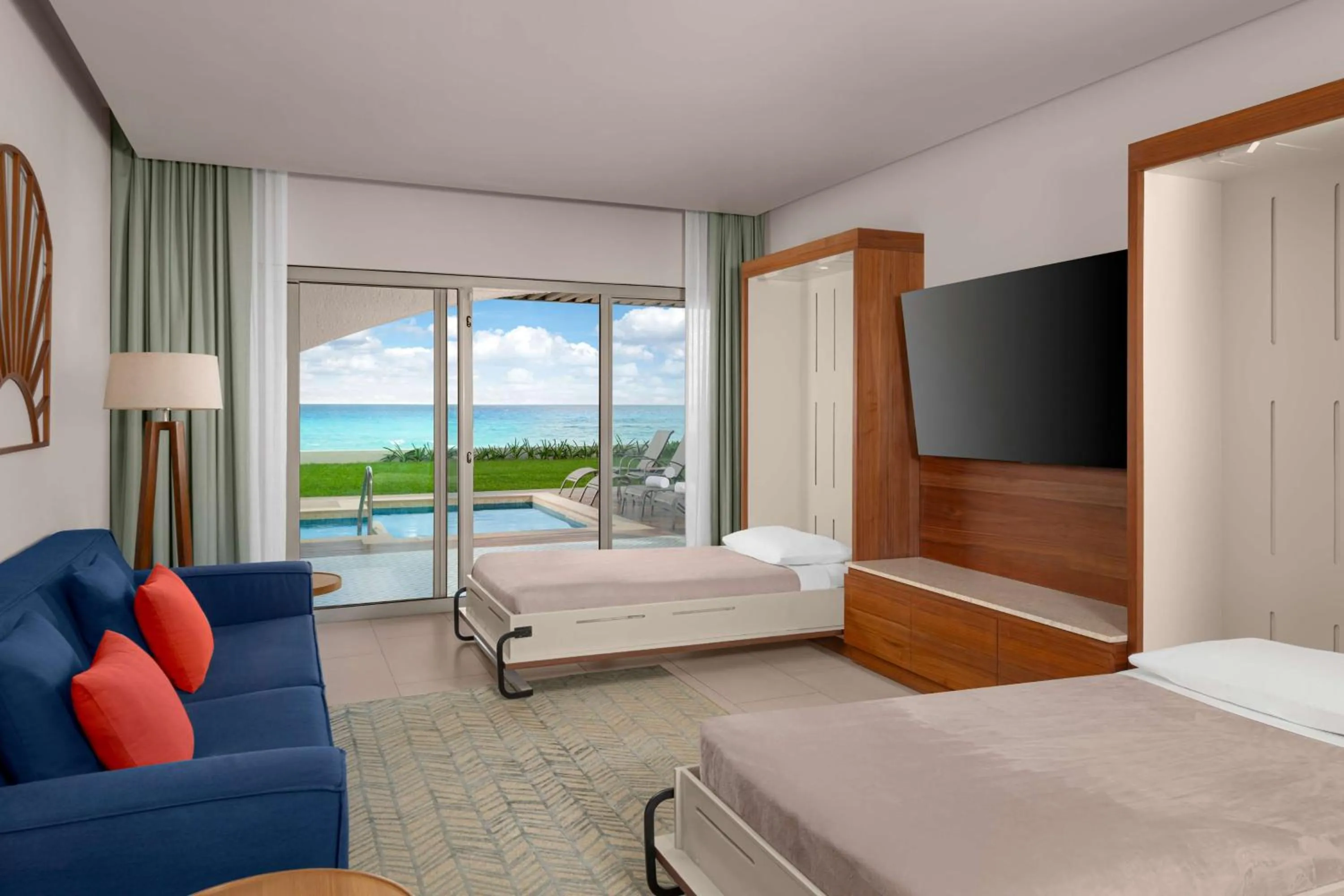 Living room, Bed in Hilton Cancun Mar Caribe All-Inclusive Resort