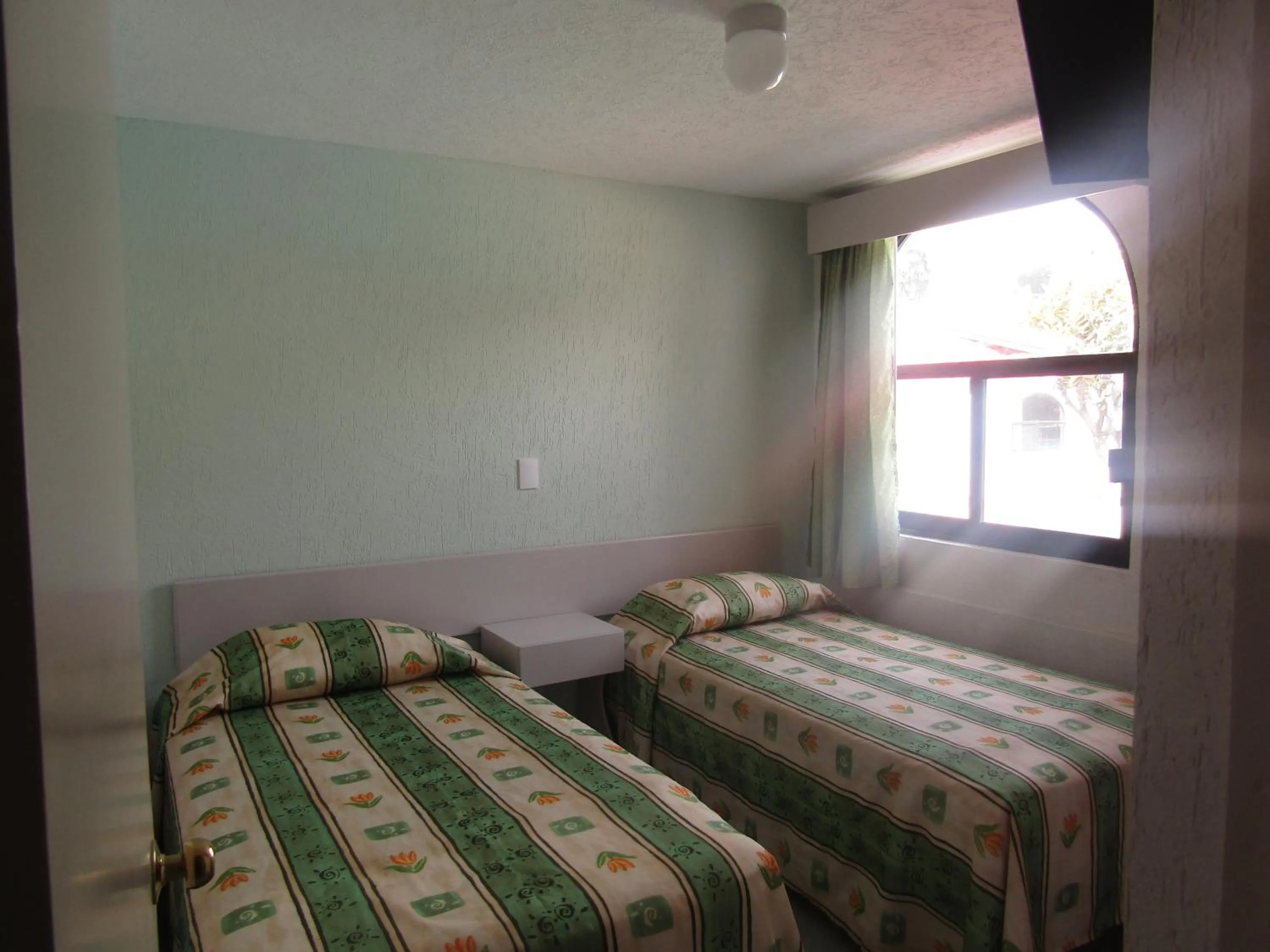 Bed in Dorados Conventions & Resort