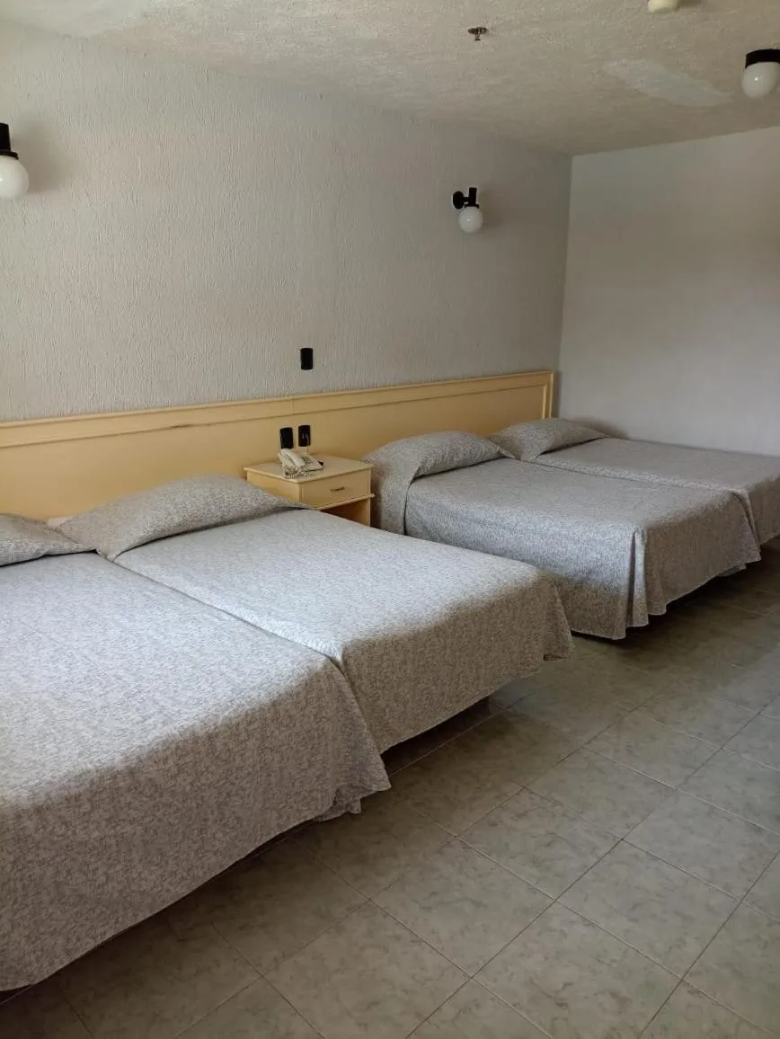 Bed in Dorados Conventions & Resort