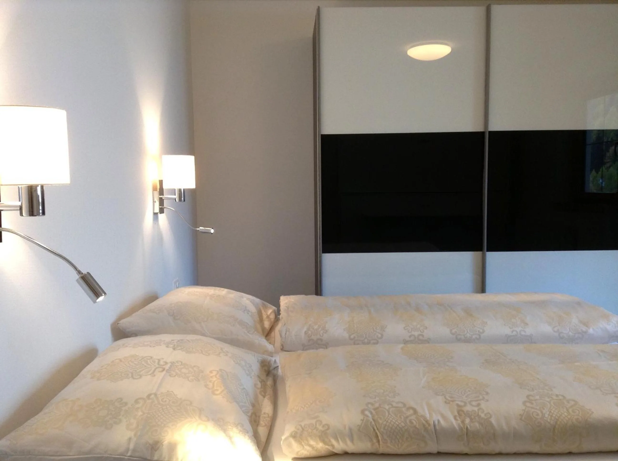 Bed in Chasa Sulai Appartements
