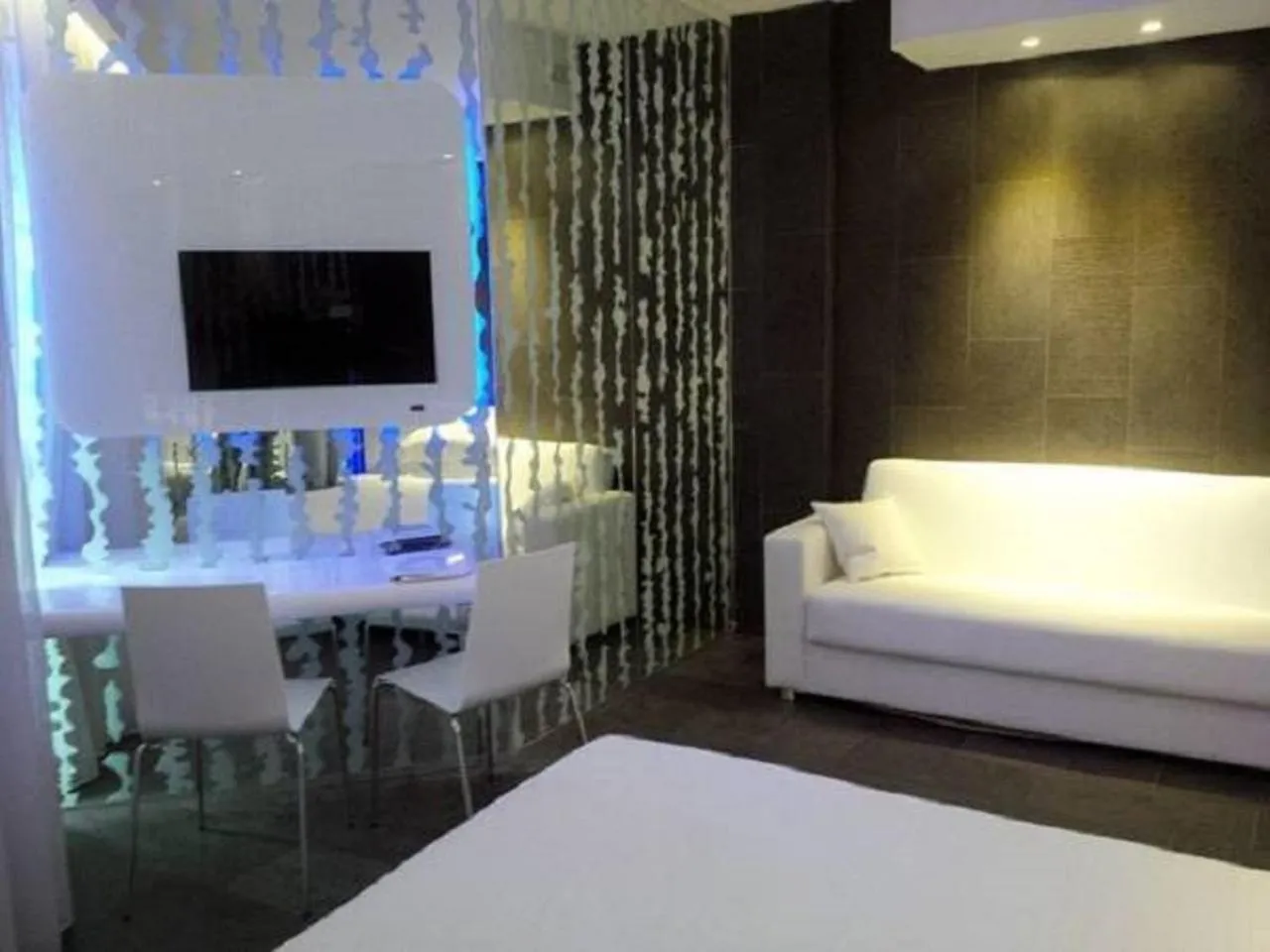 Seating area, Bed in A Point Porto Ercole Resort & Spa