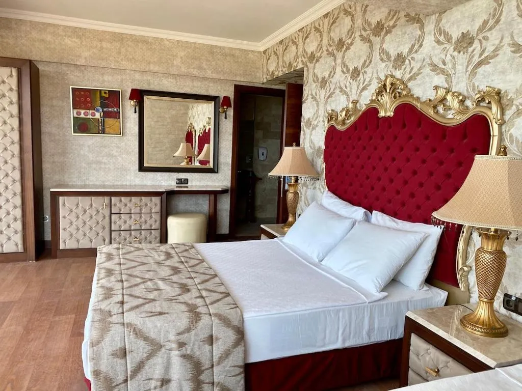 Bedroom, Bed in LAUR HOTELS Experience & Elegance