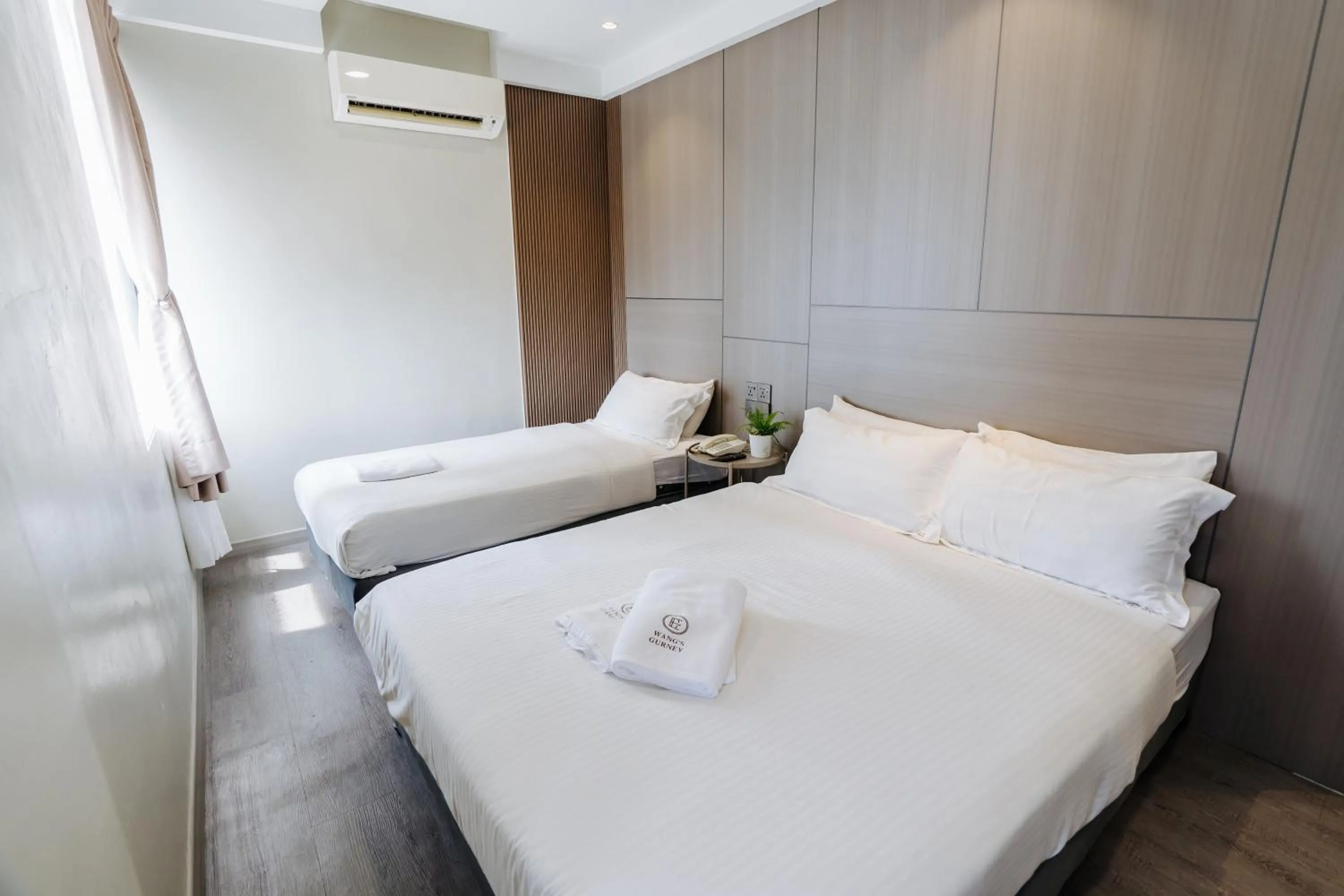 Bed in Wangs Hotel Gurney Drive