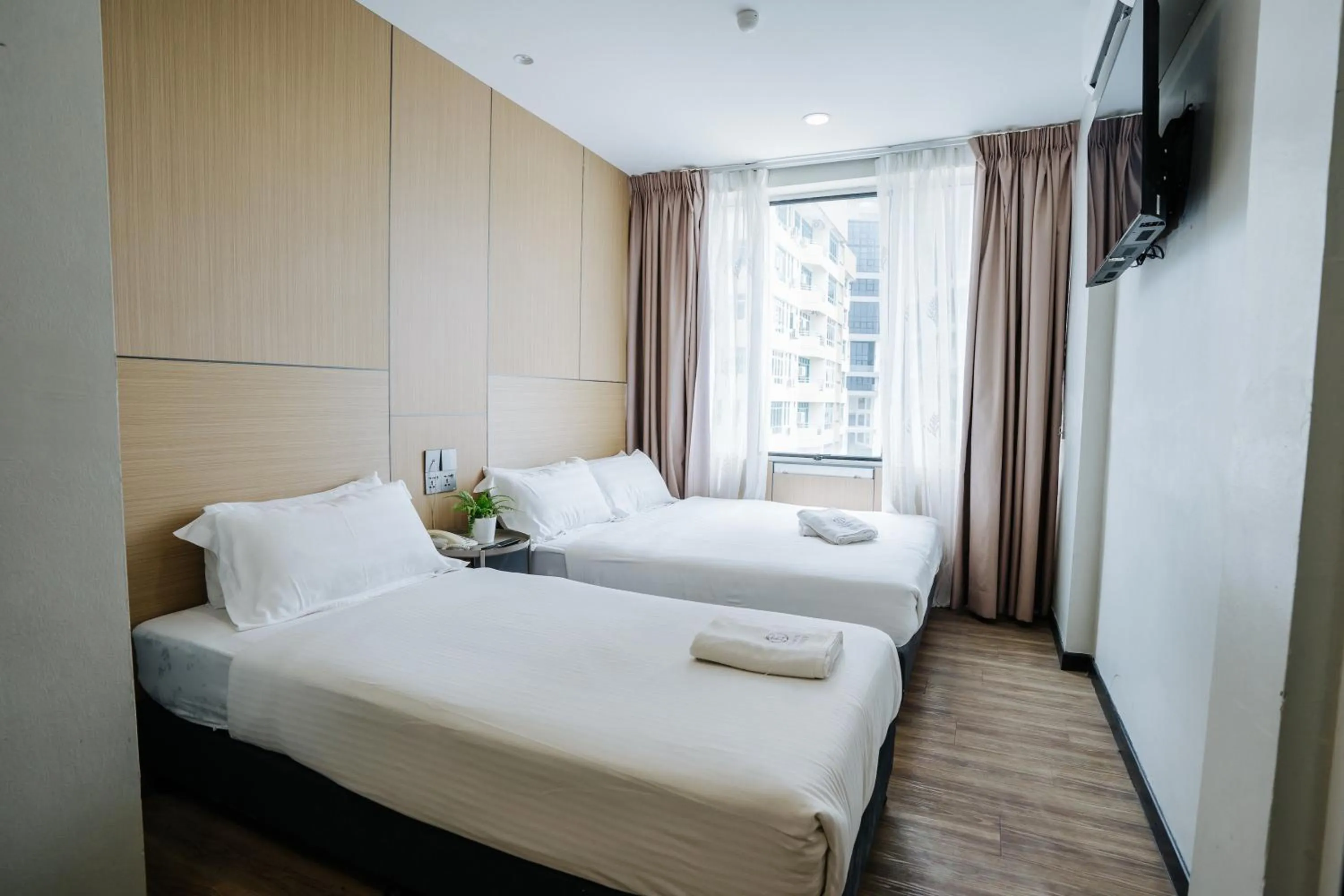 Bed in Wangs Hotel Gurney Drive