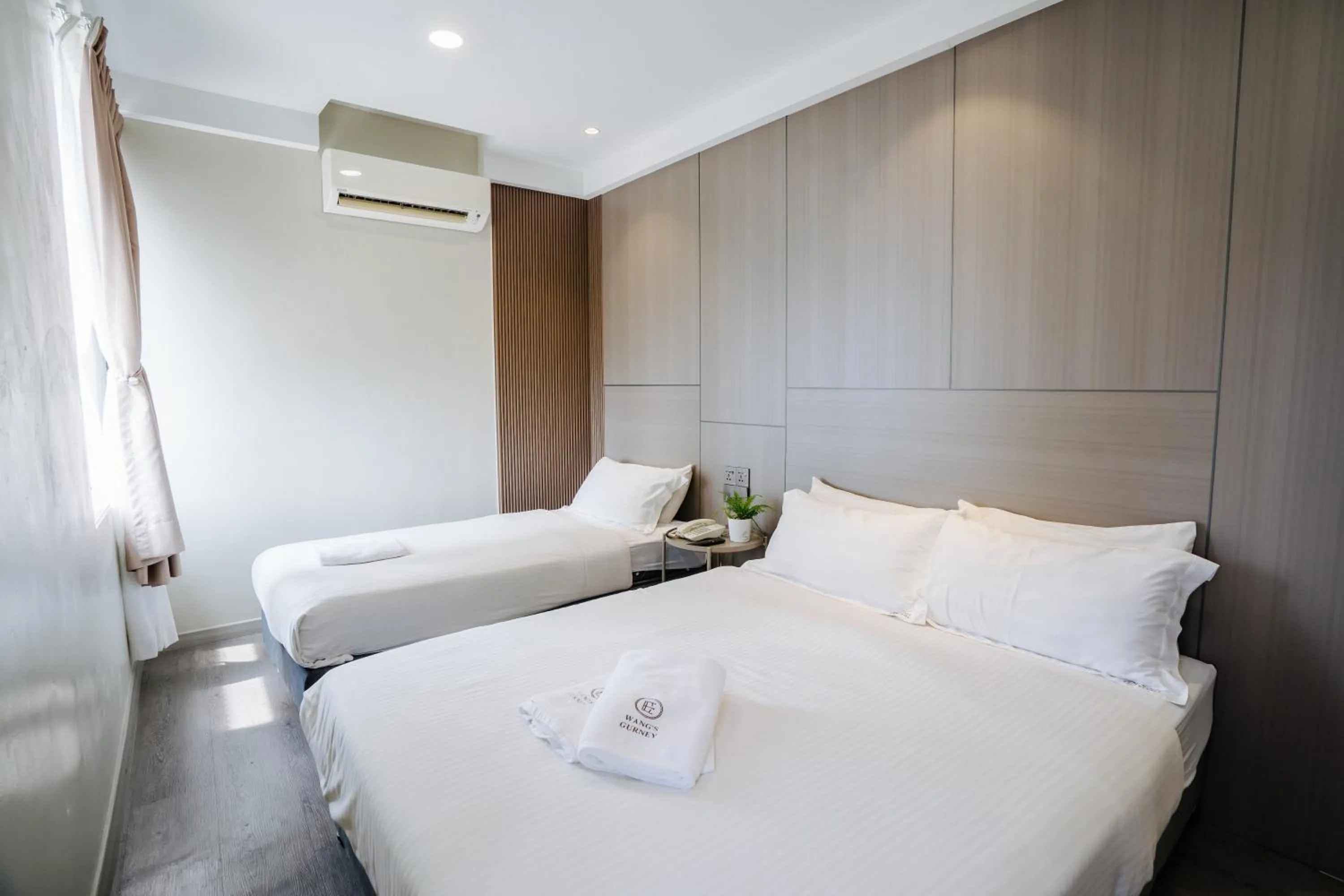 Bed in Wangs Hotel Gurney Drive