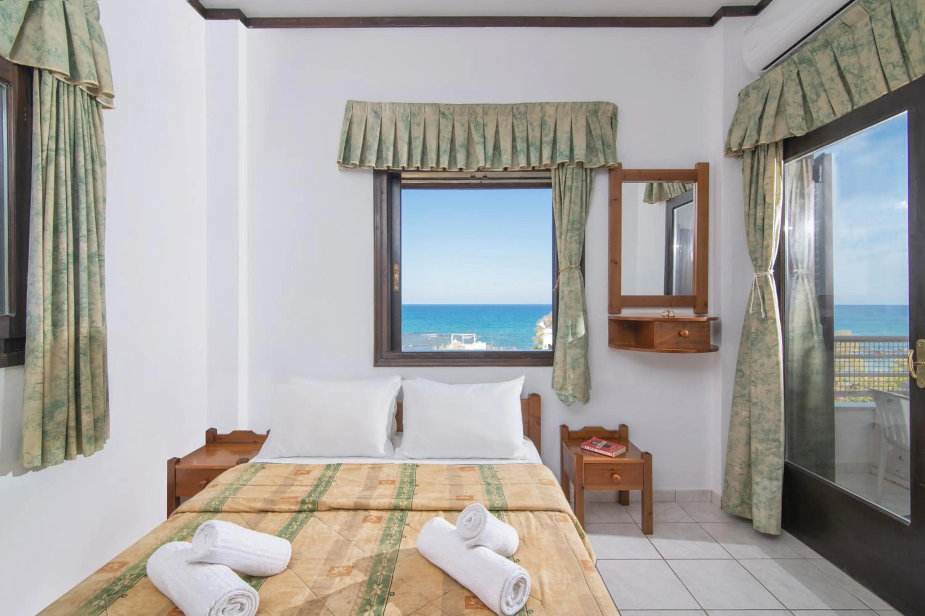 Bed in Iliostasi Beach Apartments