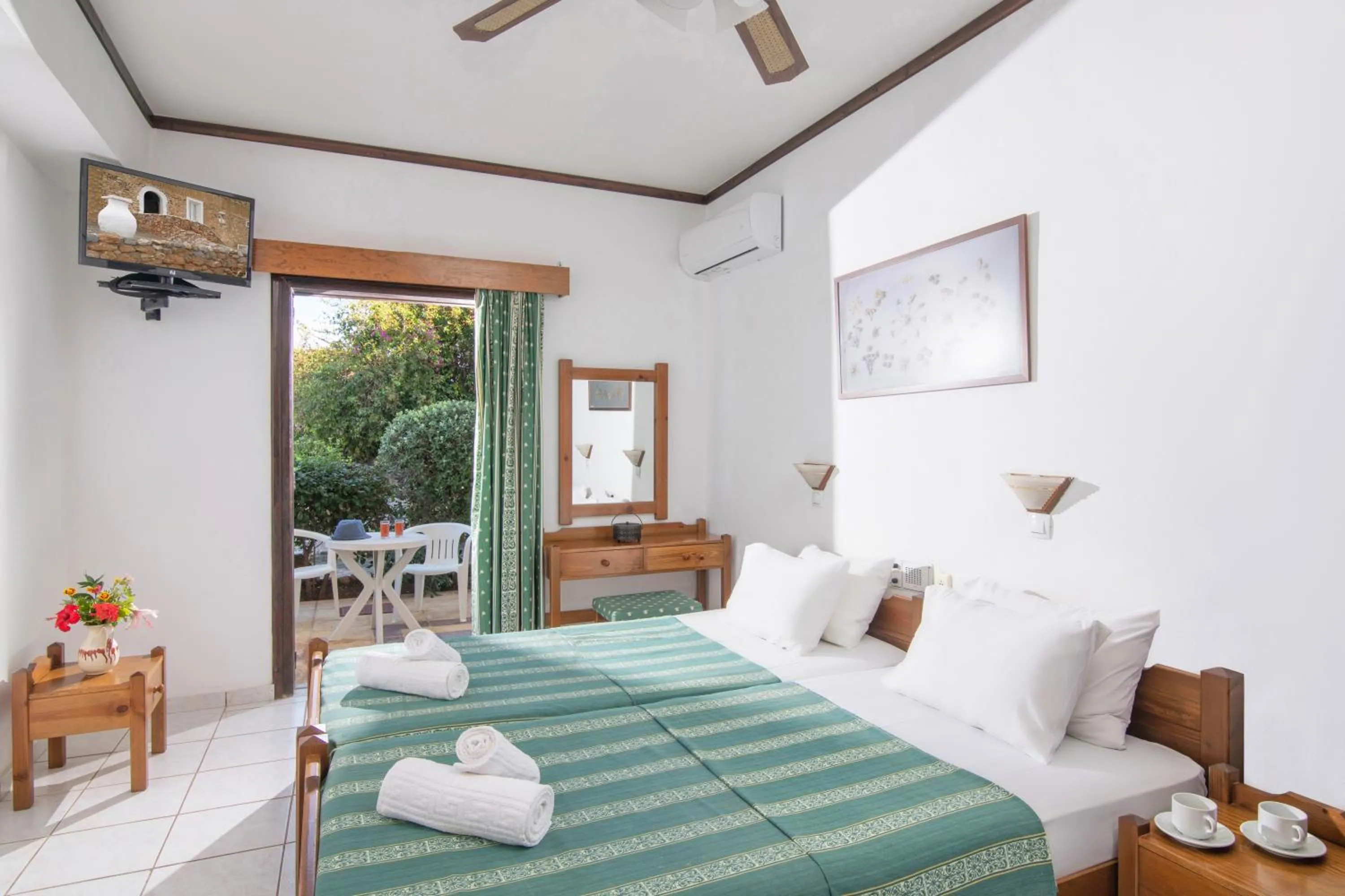 Bed in Iliostasi Beach Apartments