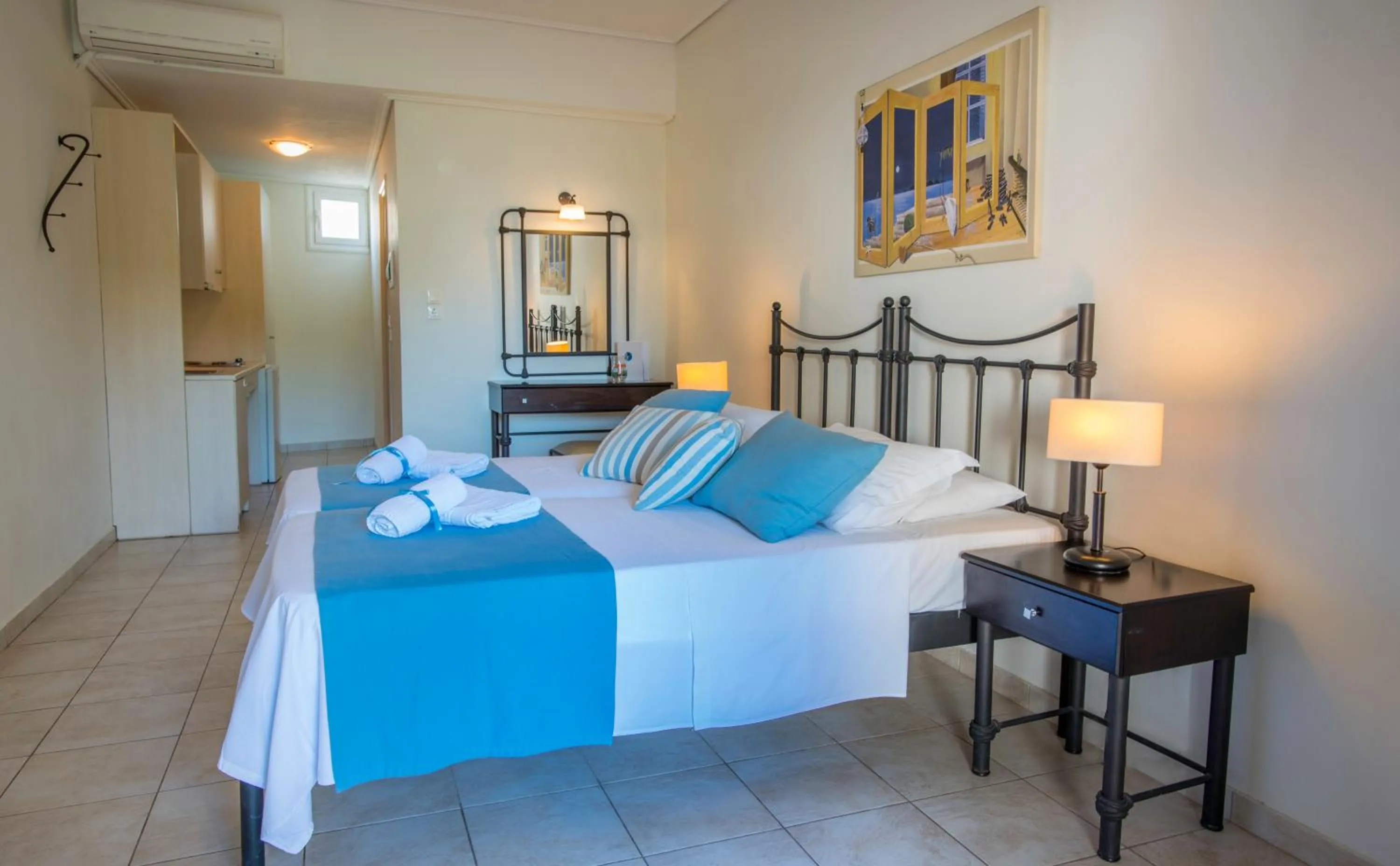 Bed in Oasis Beach Hotel