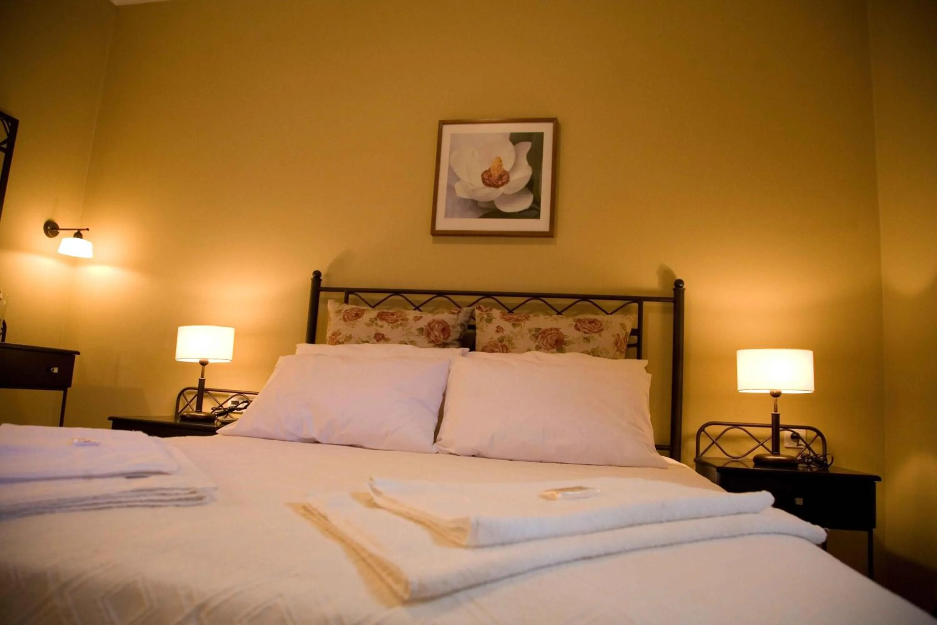 Bed in Oasis Beach Hotel