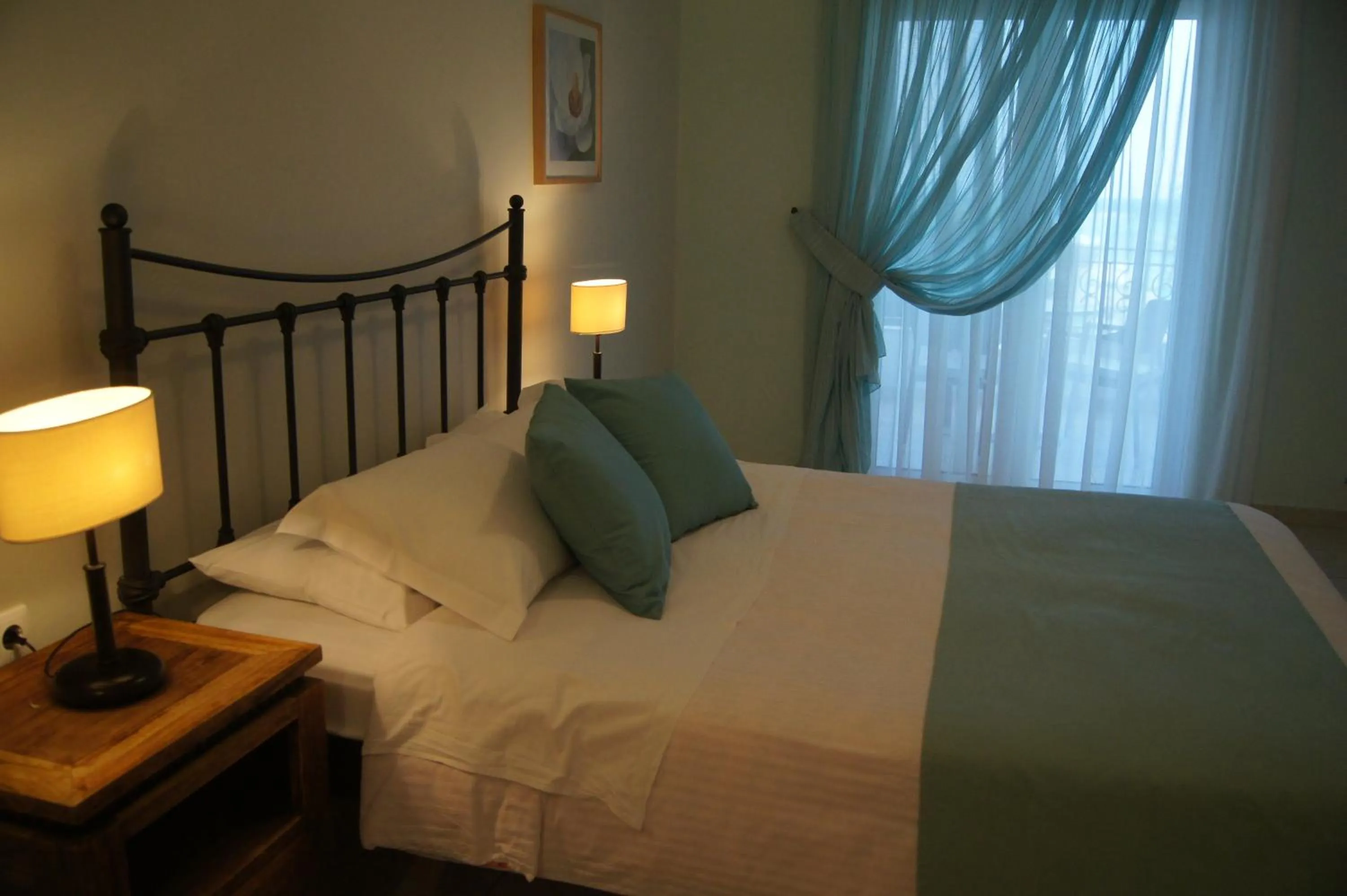 Bed in Oasis Beach Hotel