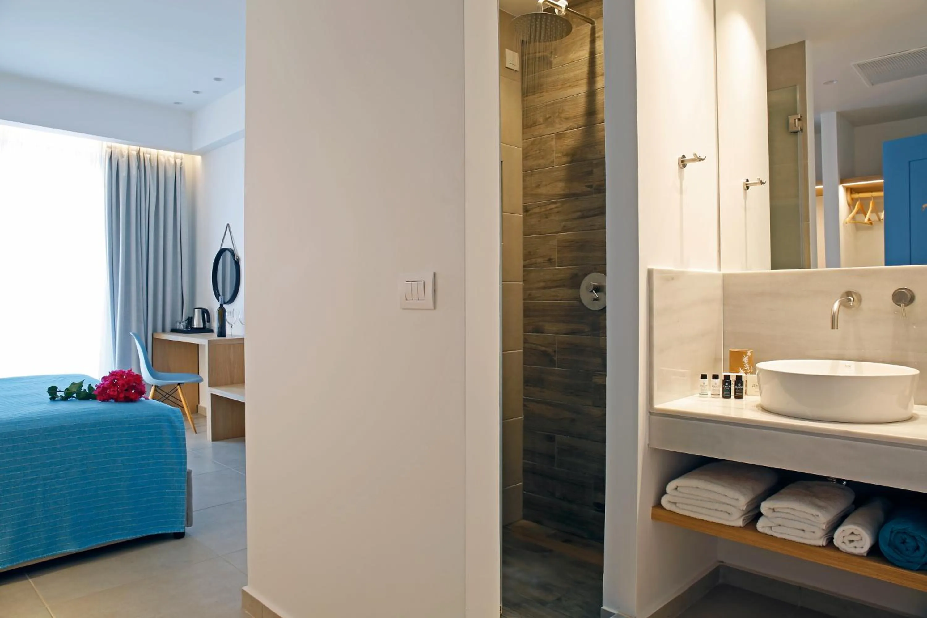 Bathroom, Bed in Oasis Beach Hotel