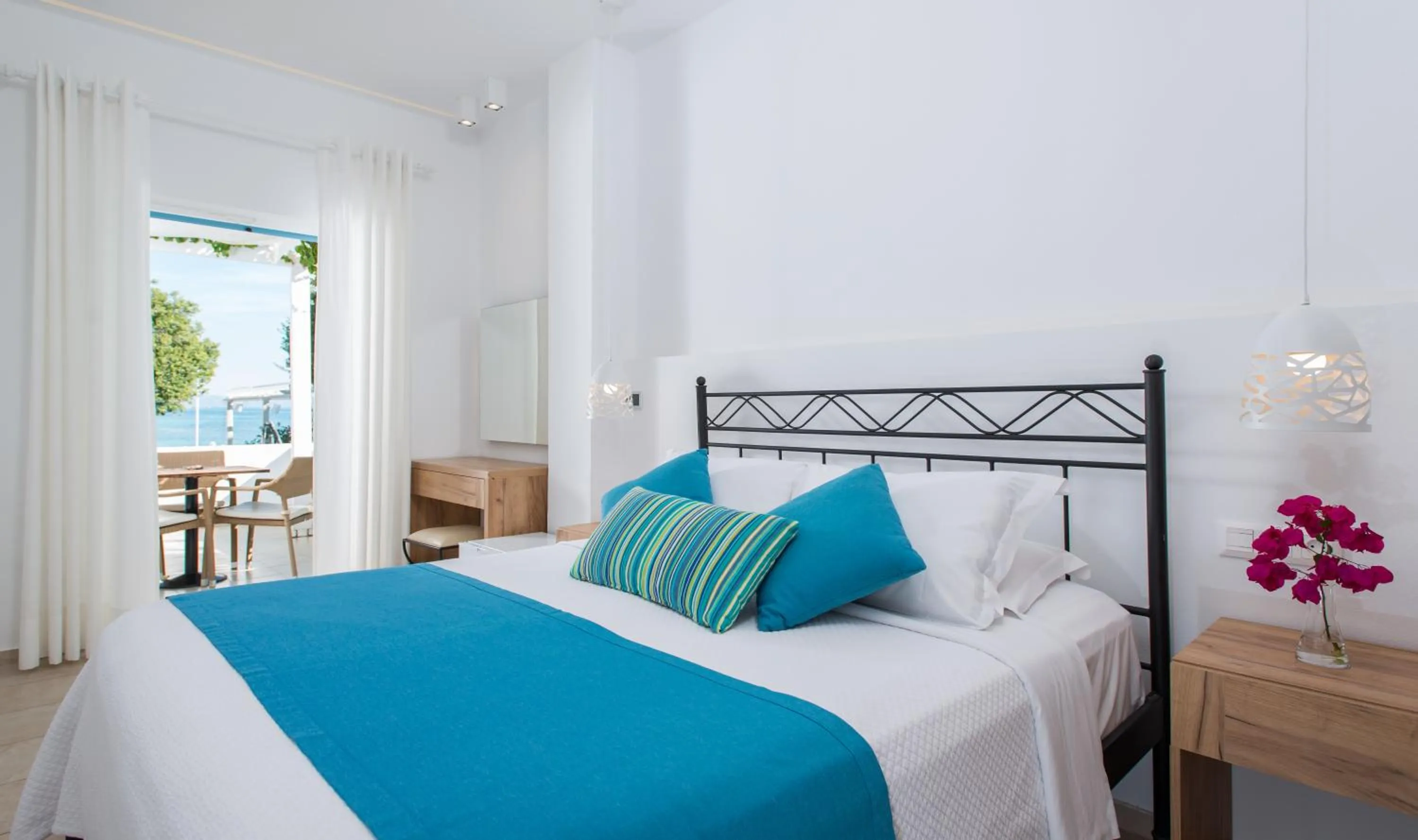 Bed in Oasis Beach Hotel