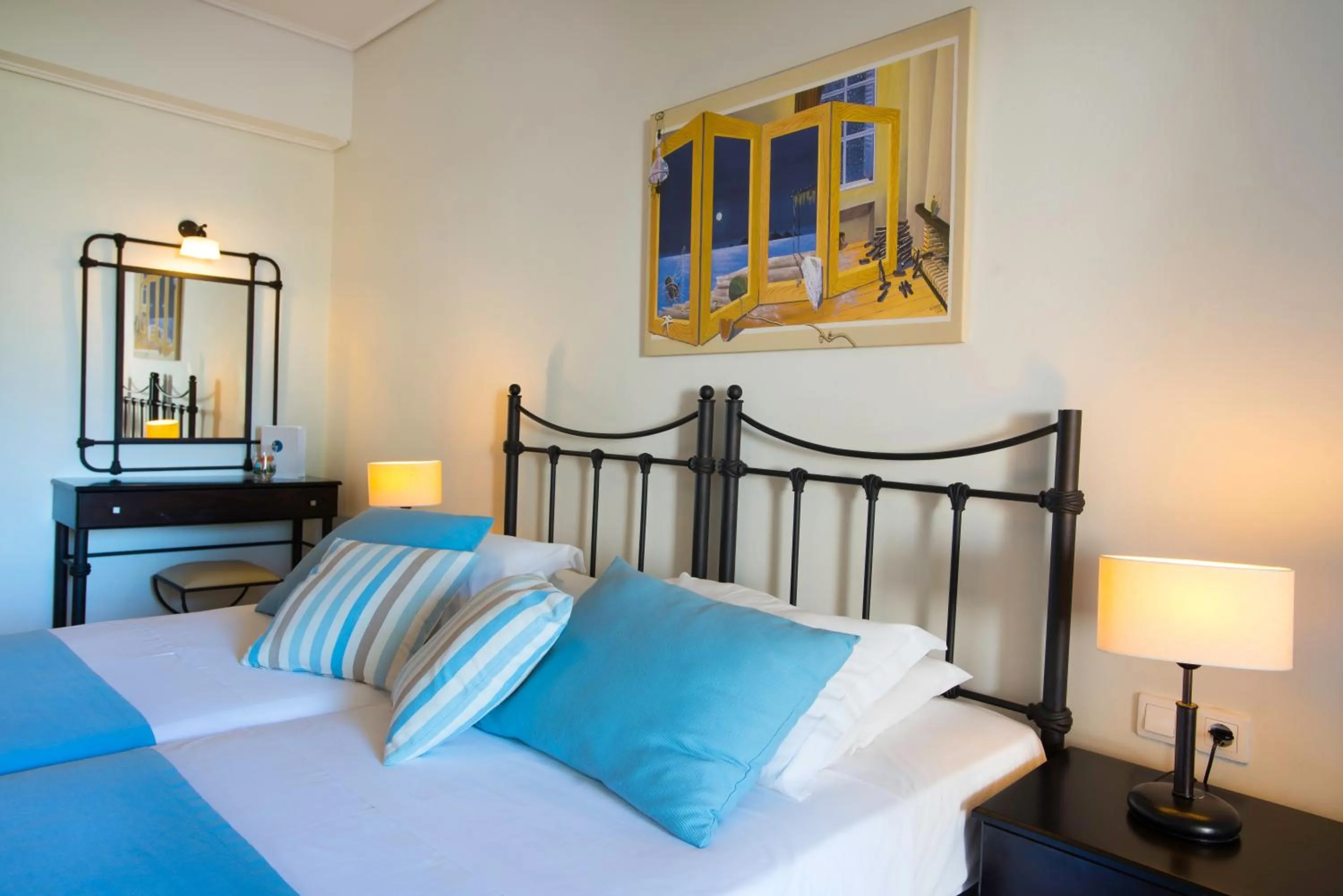 Bed in Oasis Beach Hotel