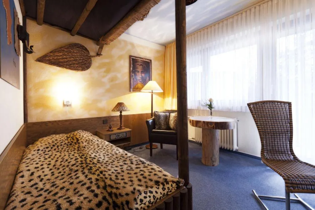 Photo of the whole room, Bed in Themen Hotel Terrassen Cafe