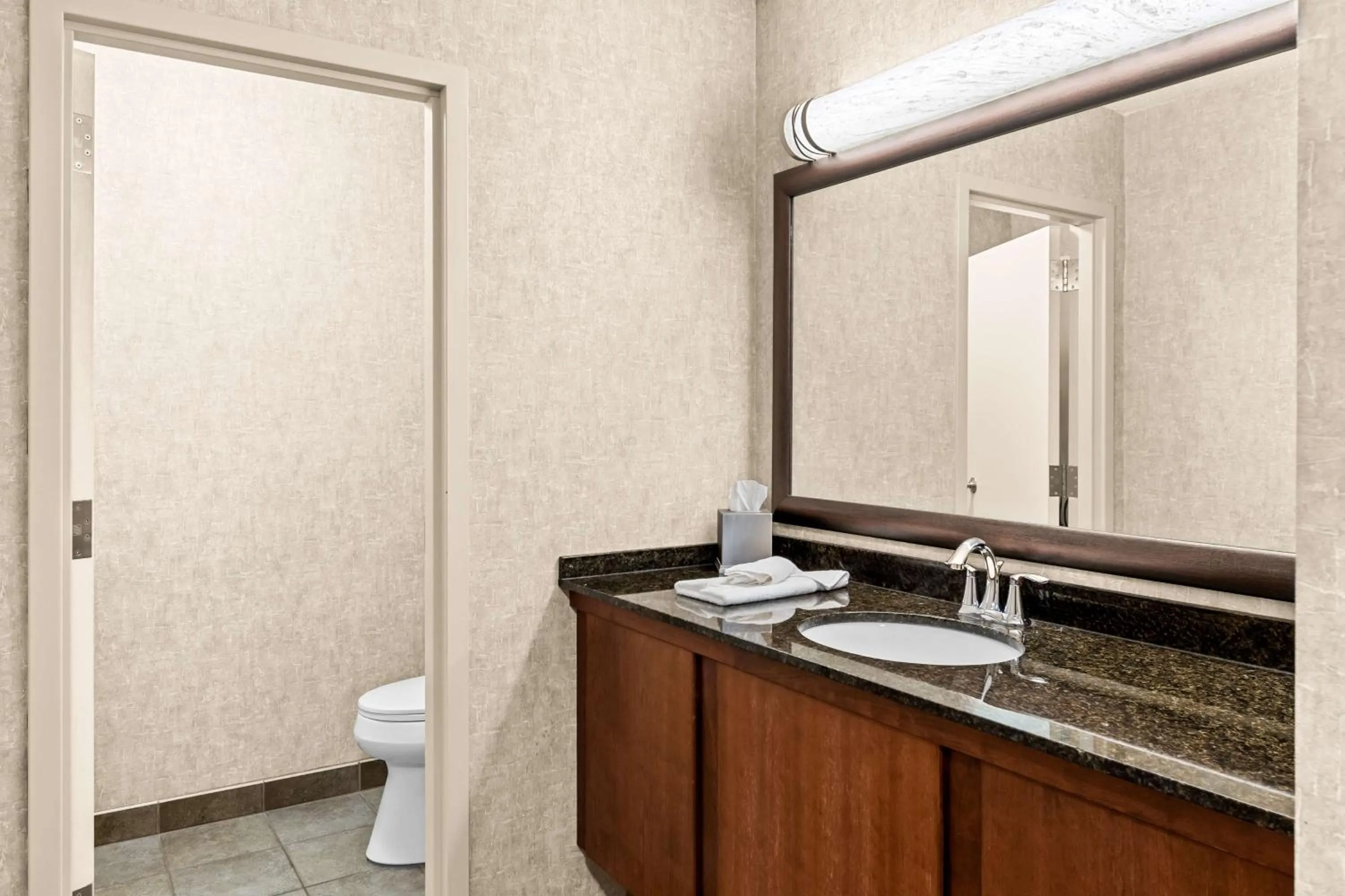 Bathroom in Heartland Inn & Suites, SureStay Collection by Best Western