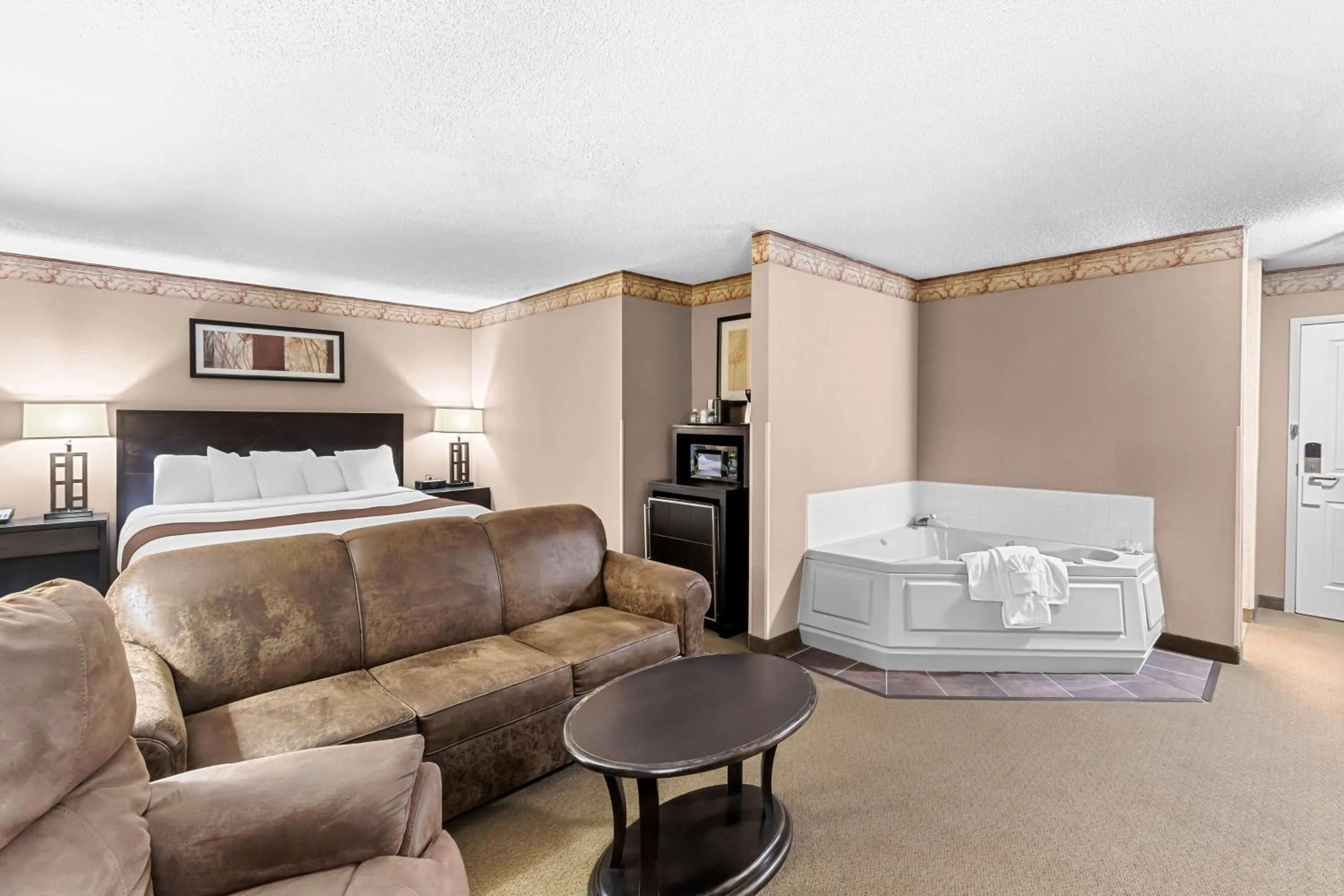 Photo of the whole room, Bed in Heartland Inn & Suites, SureStay Collection by Best Western