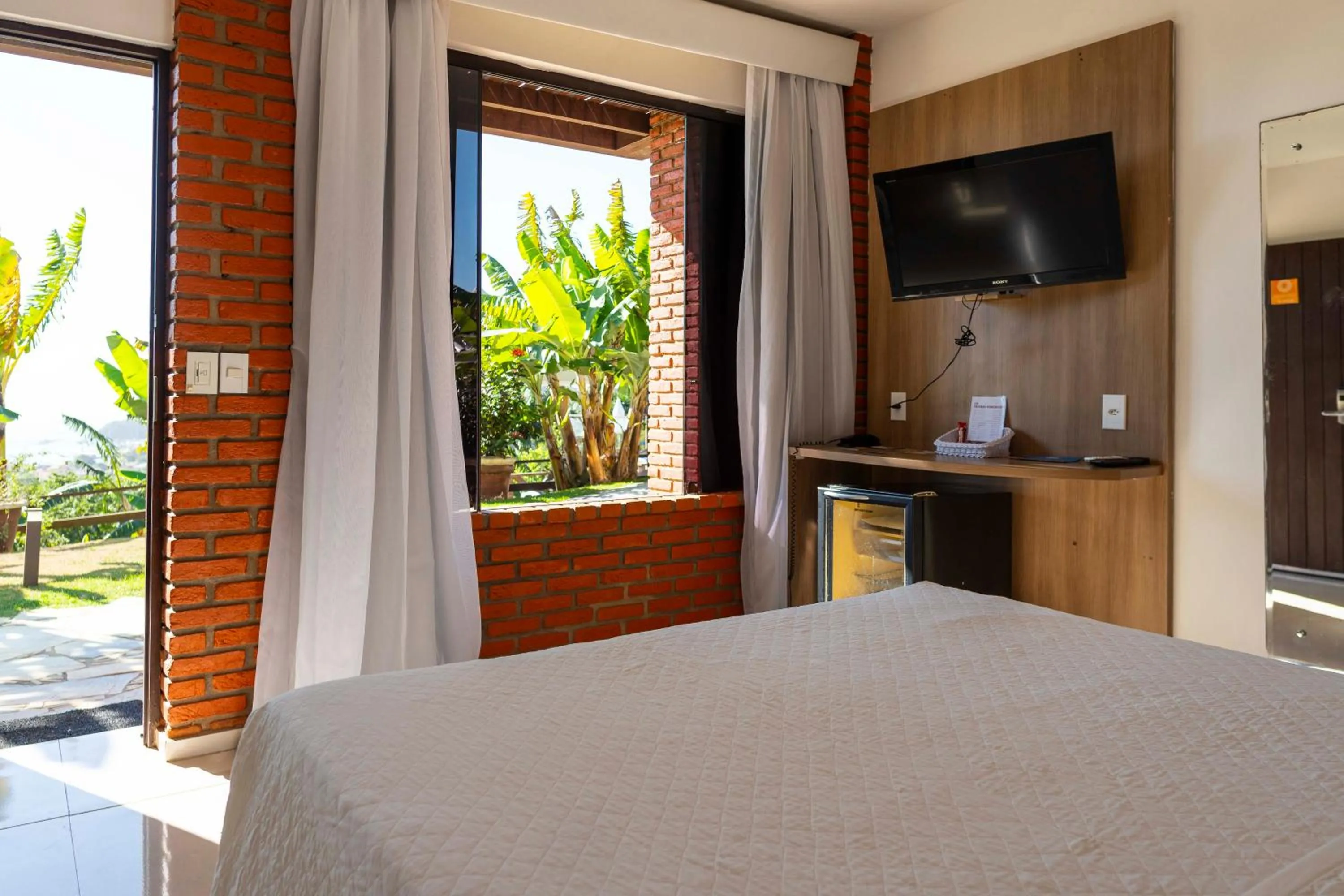 View (from property/room), Bed in Costa do Sol Boutique Hotel