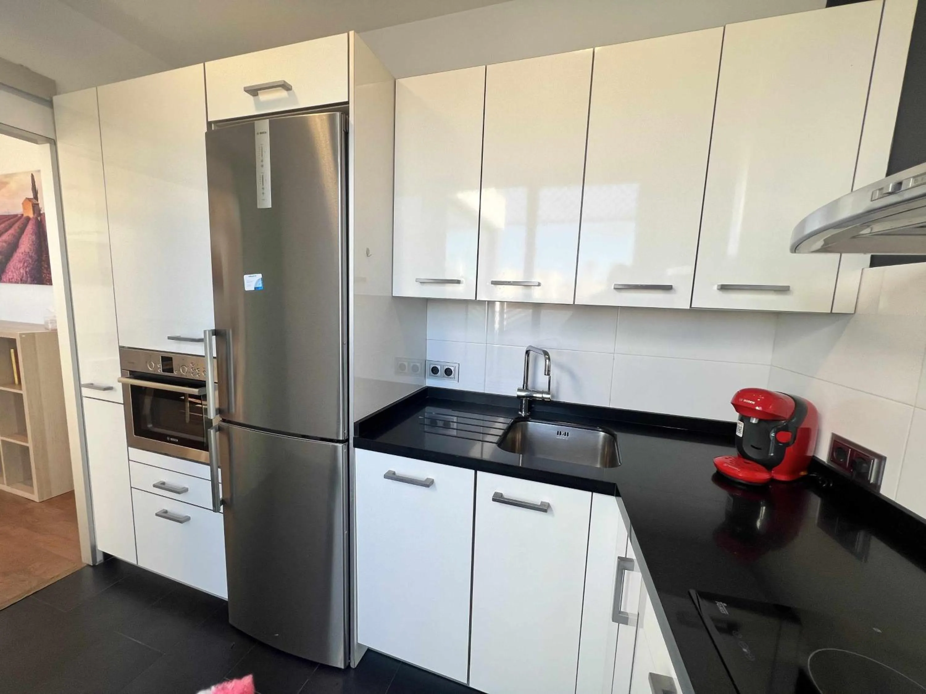Kitchen or kitchenette in Ático San Bernardo Terraza y Parking Incluido