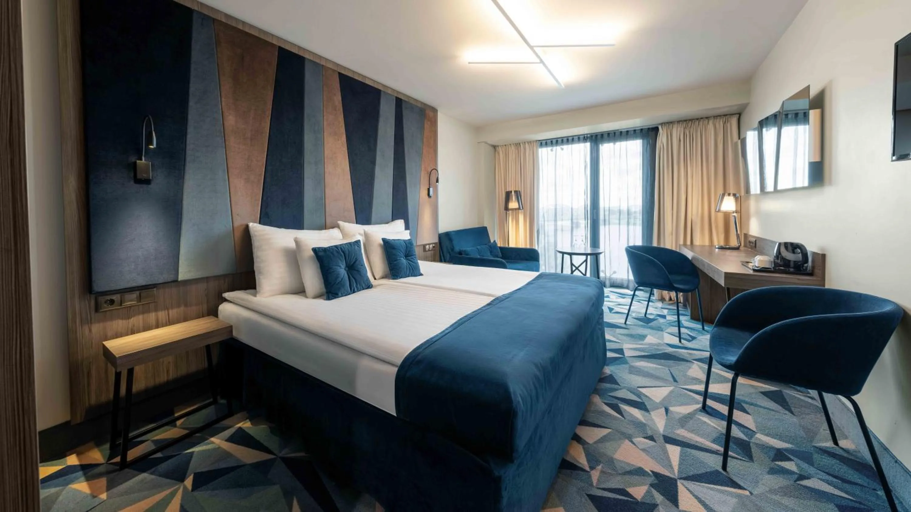 Bed in Wellton Riverside SPA Hotel