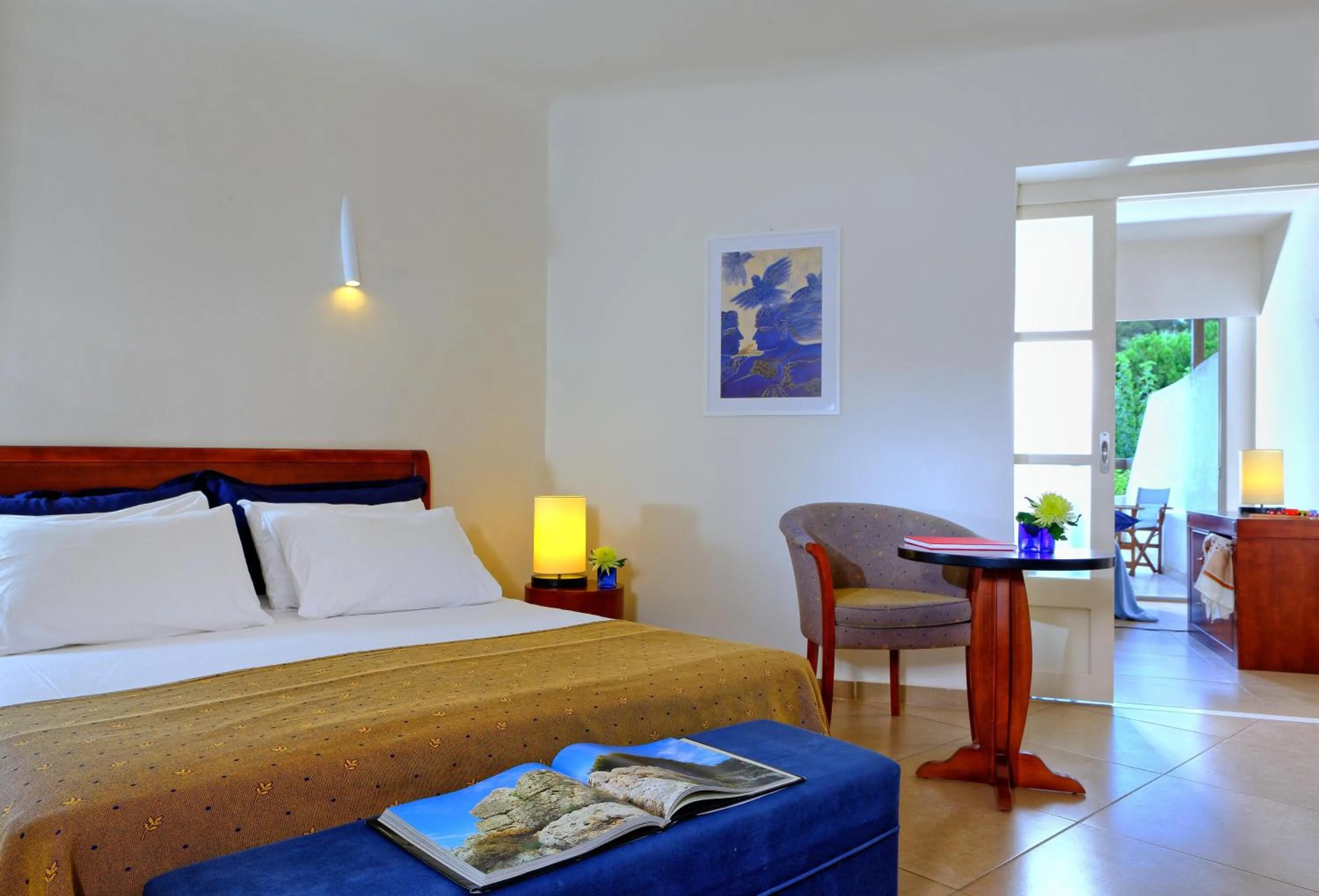 Bed in Apollonia Beach Resort & Spa