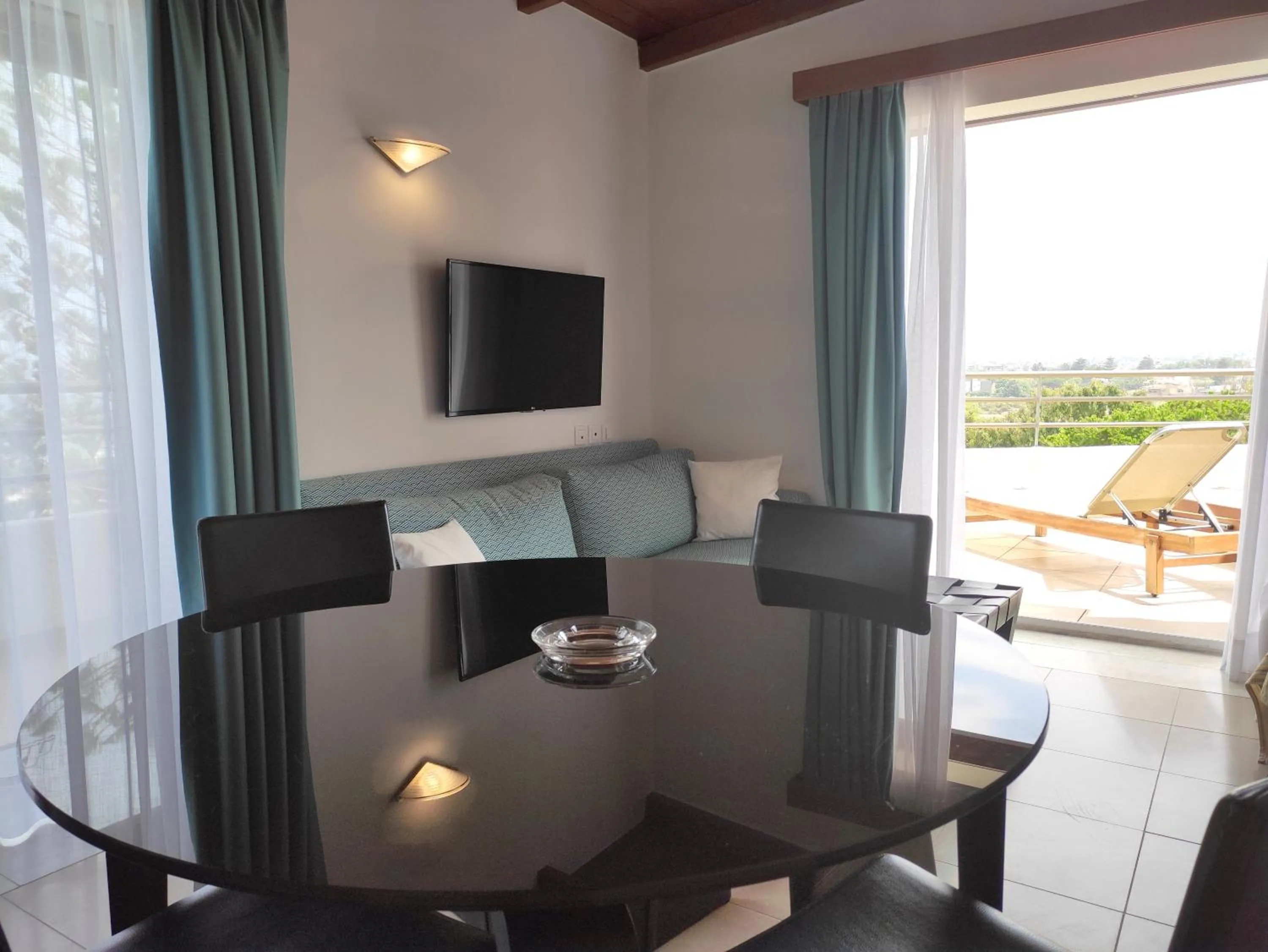 TV and multimedia in Apollonia Beach Resort & Spa