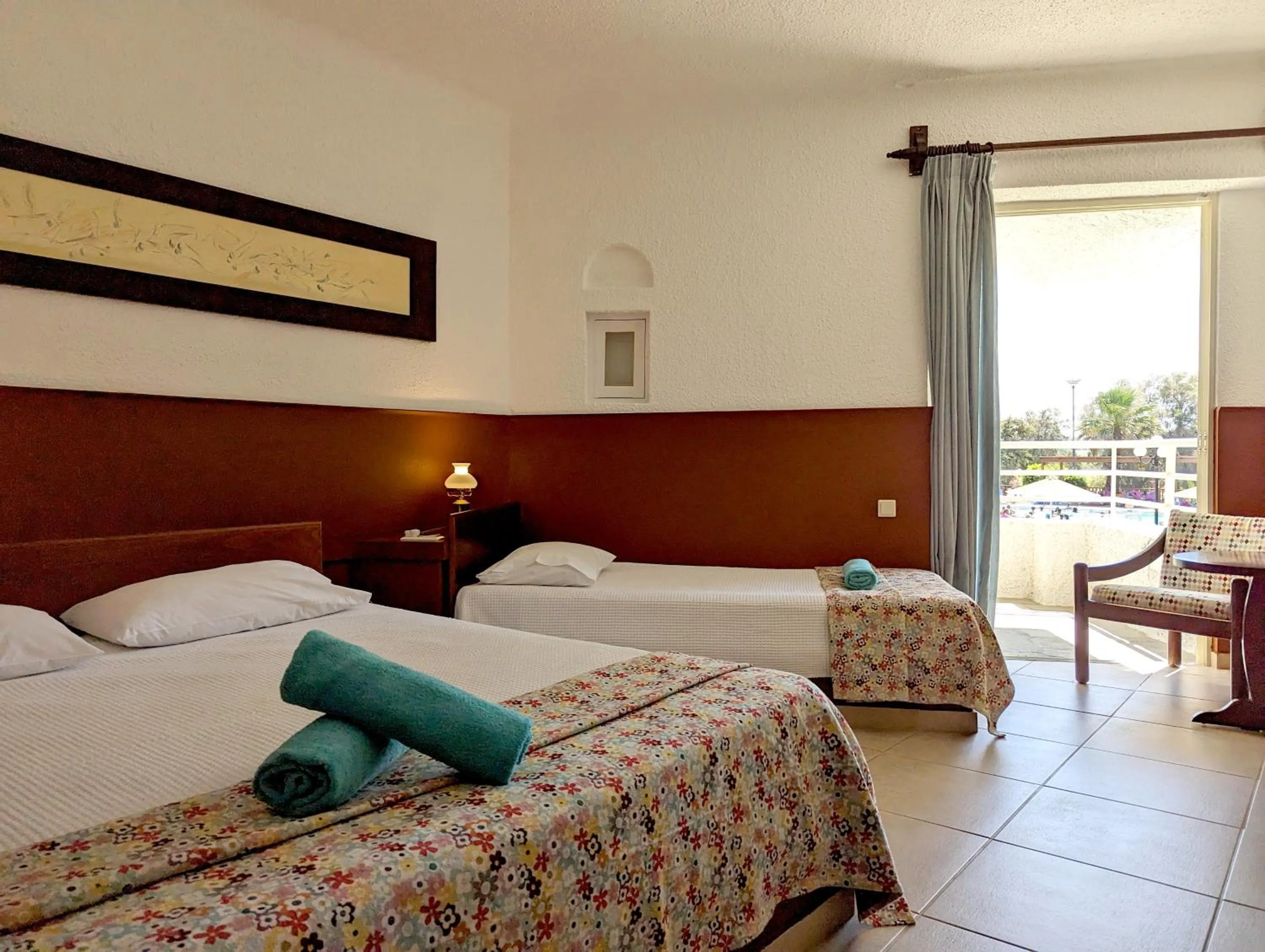 Bed in Apollonia Beach Resort & Spa