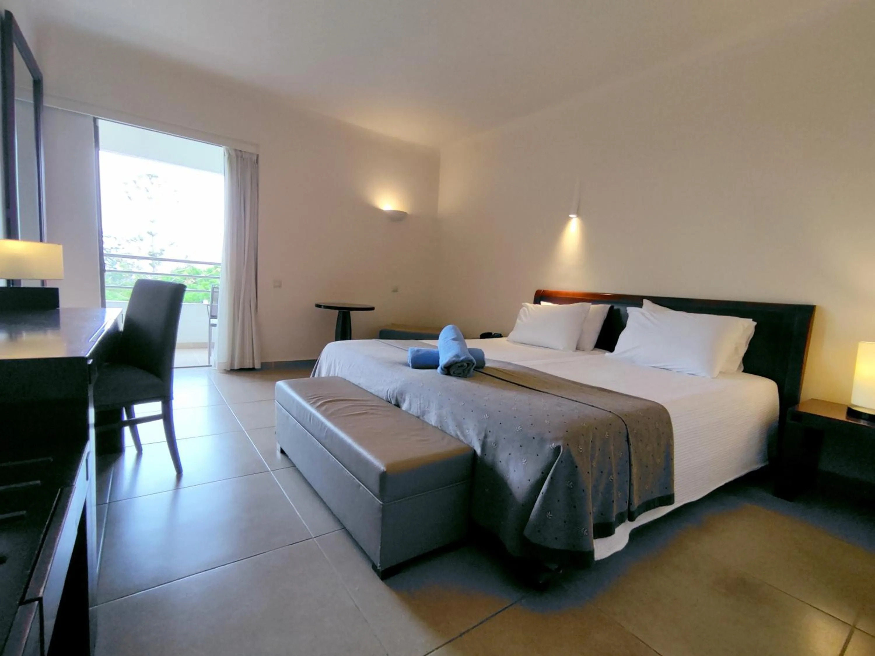Bed in Apollonia Beach Resort & Spa