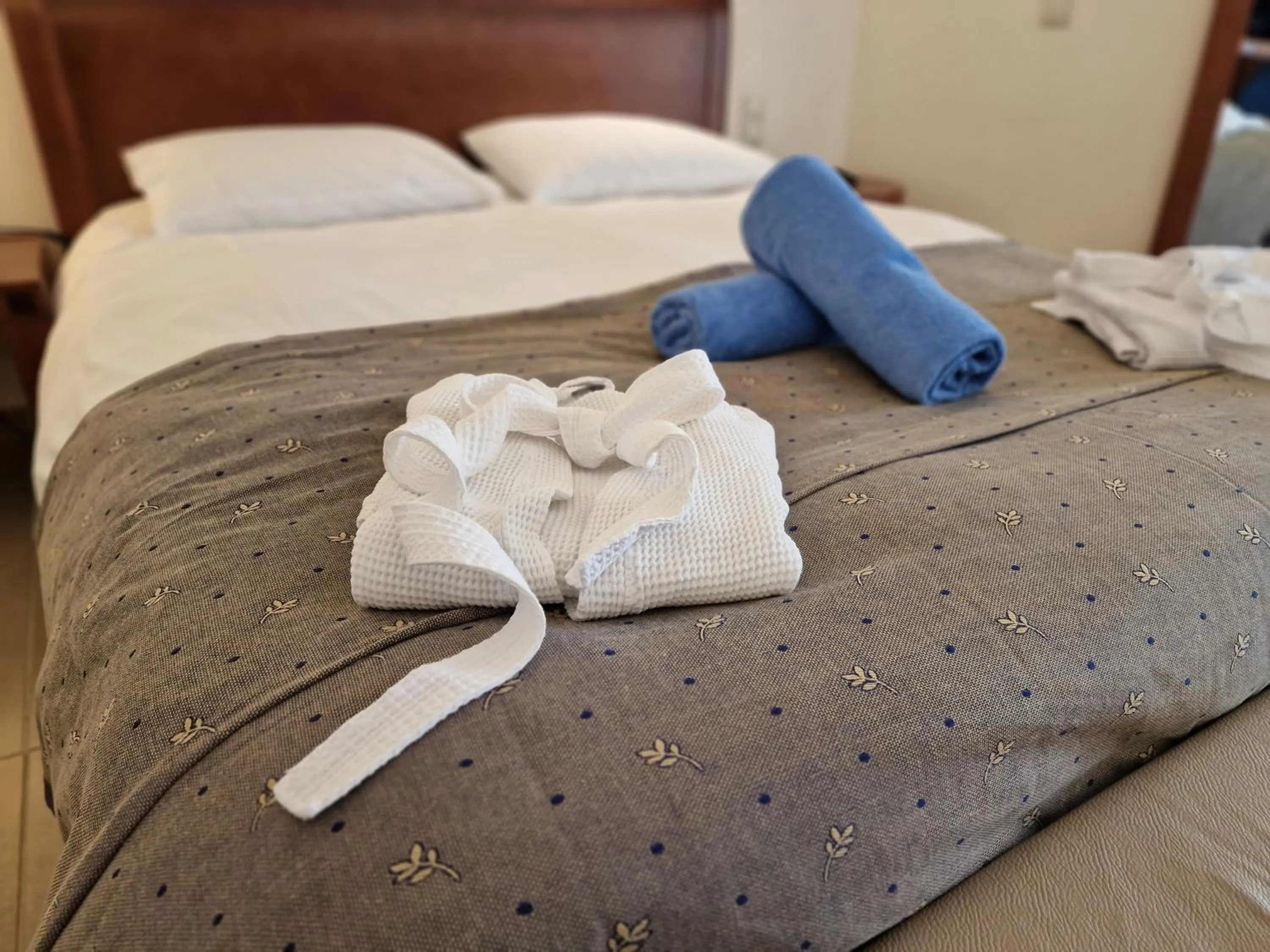 Bed in Apollonia Beach Resort & Spa