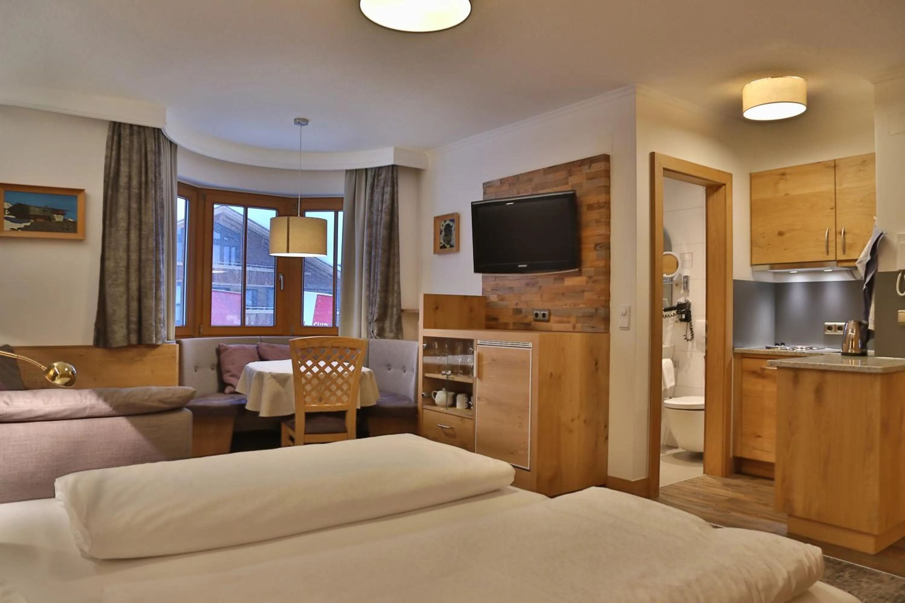 Living room, Bed in Aparthotel Acksteiner