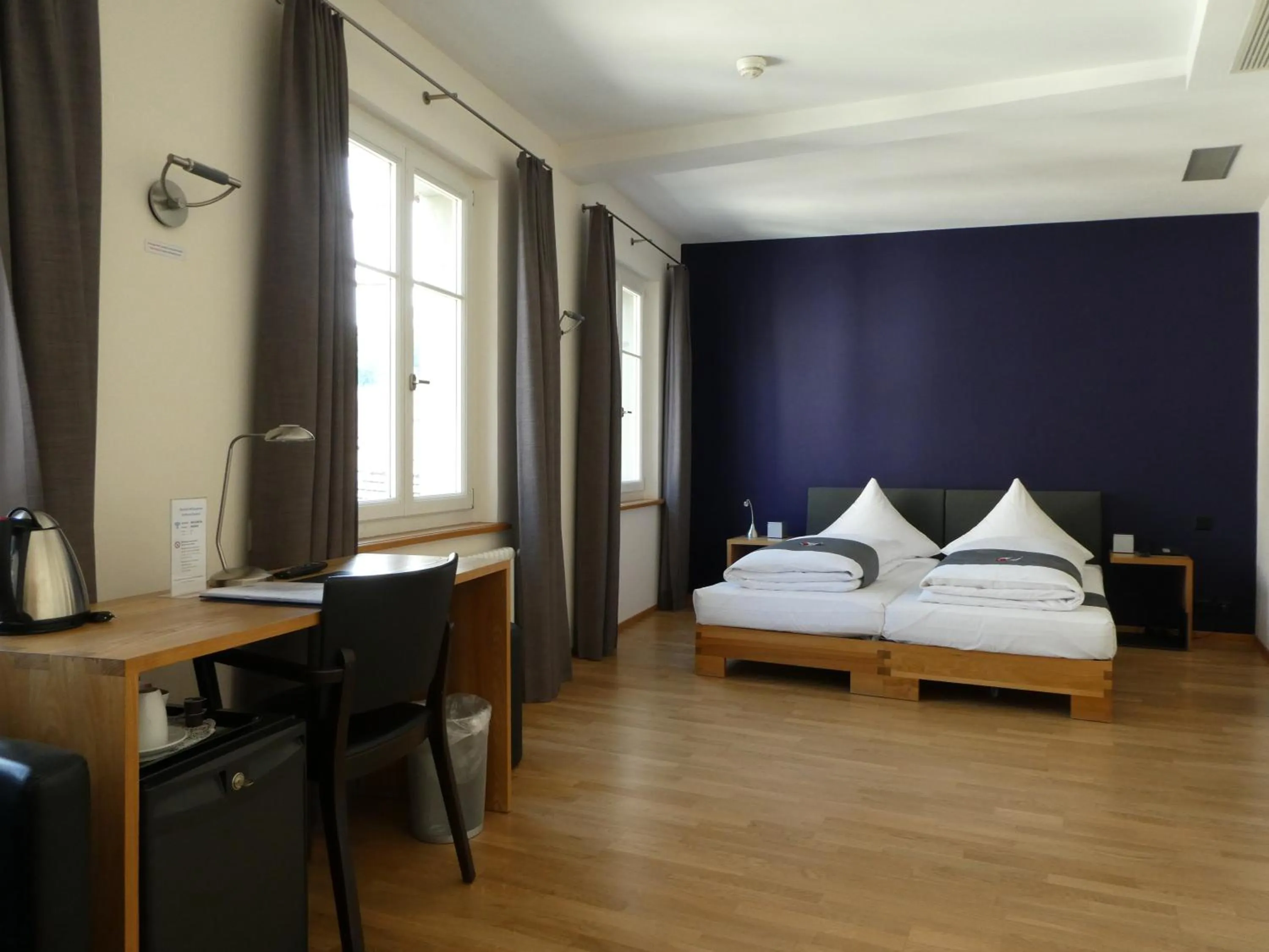 Bed in Hotel Le Lion - Self Check-in