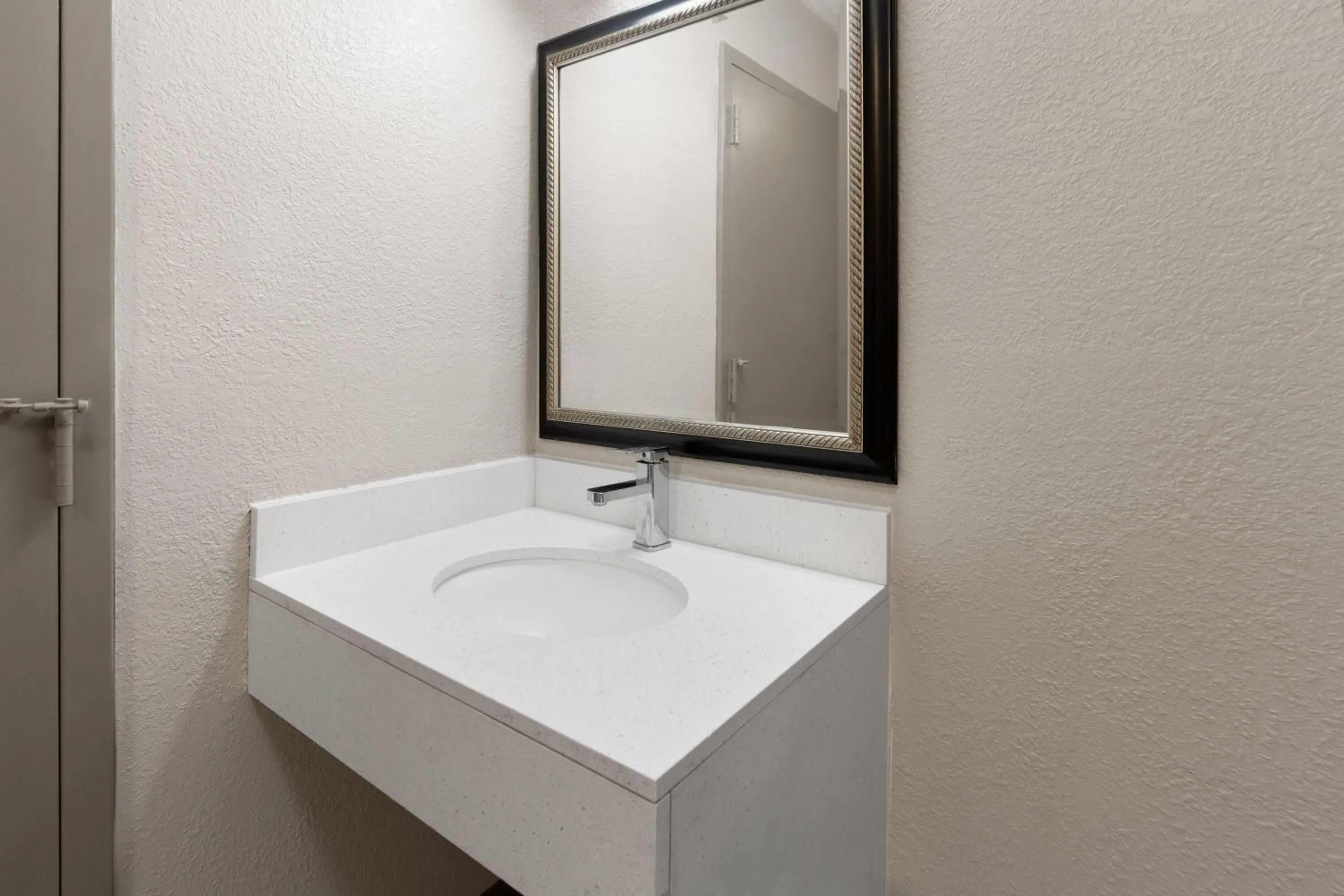 Bathroom in Days Inn by Wyndham Cambridge