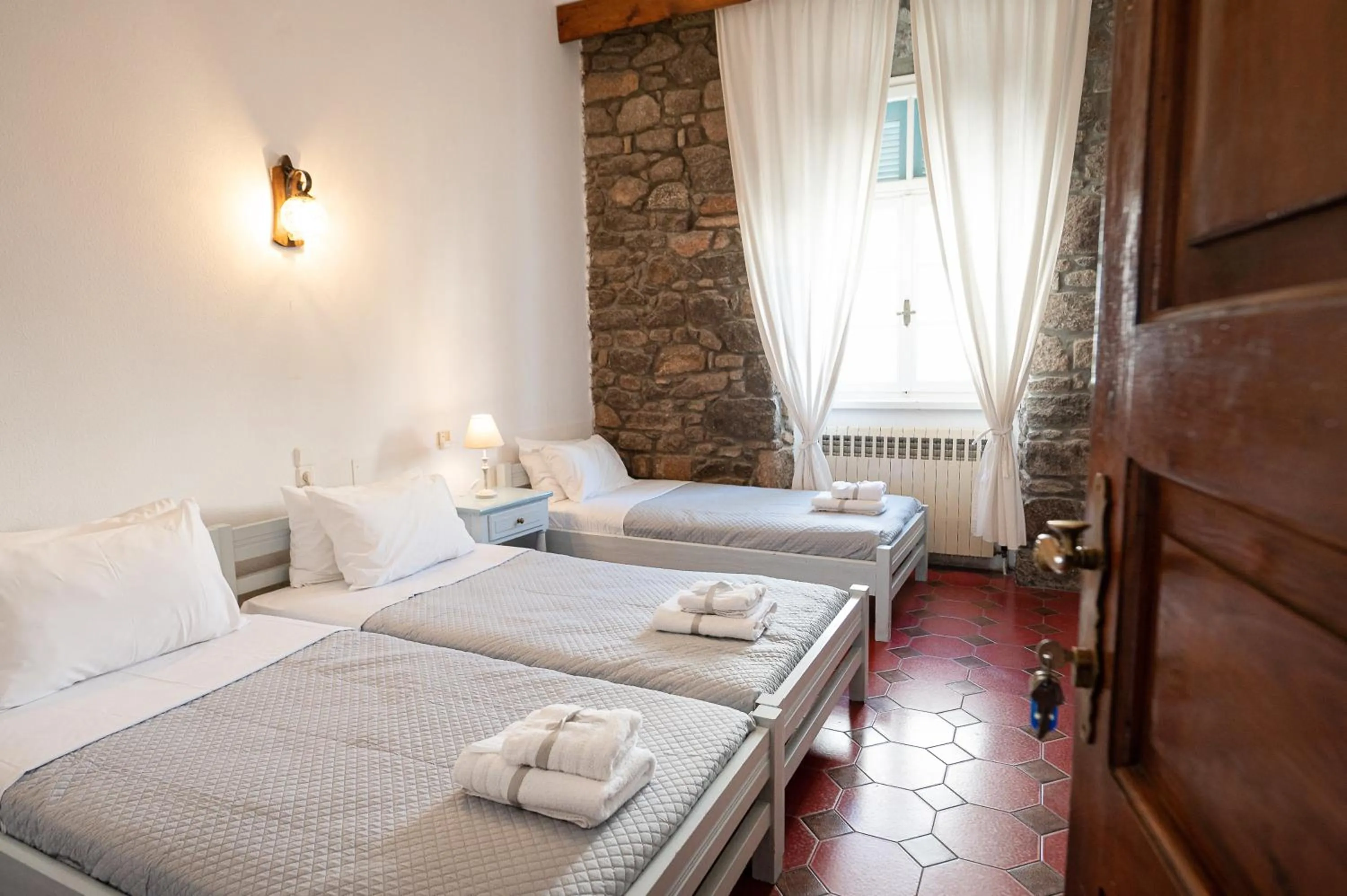 Bed in Dionysos Hotel