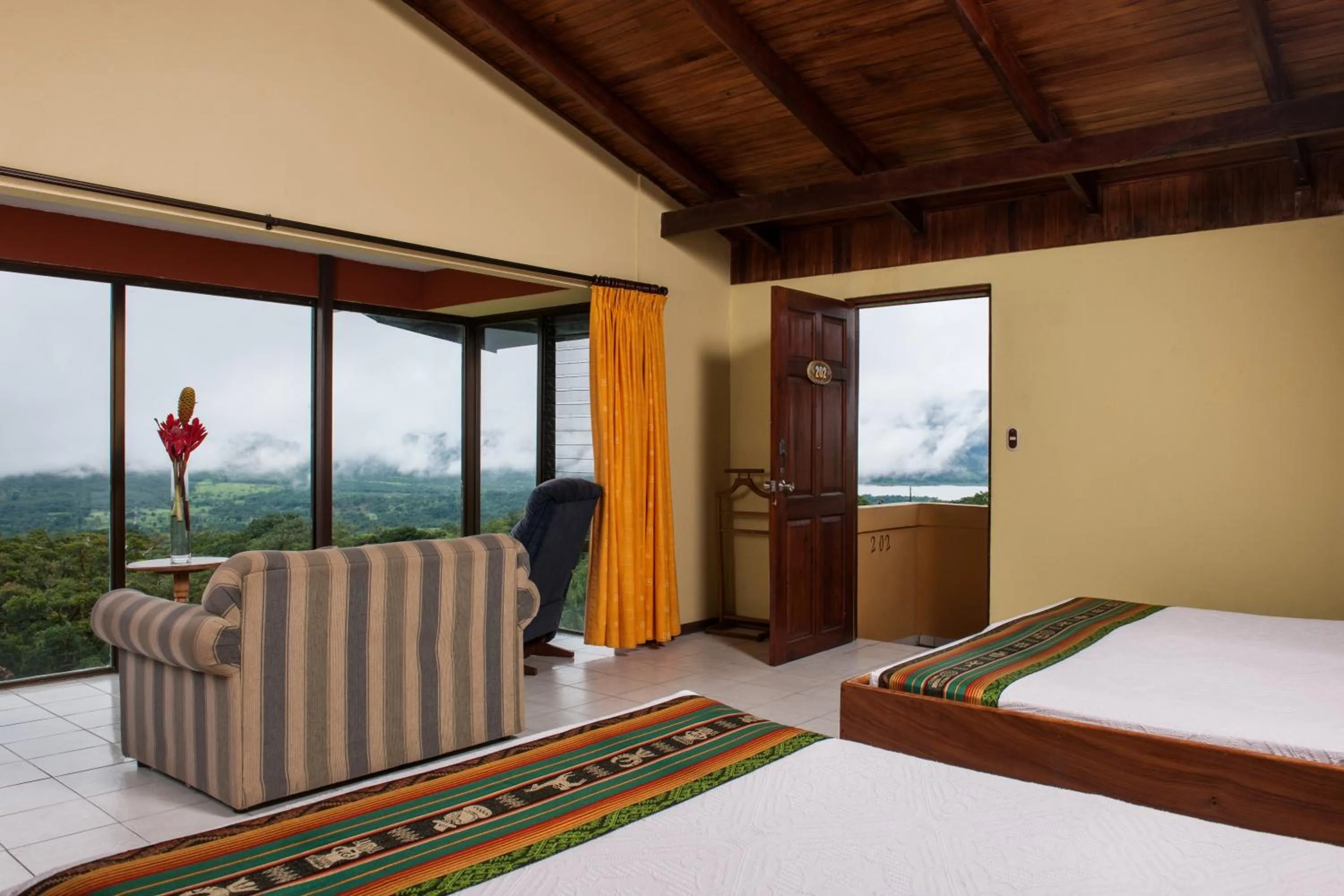 Photo of the whole room, Bed in Hotel Arenal Lodge