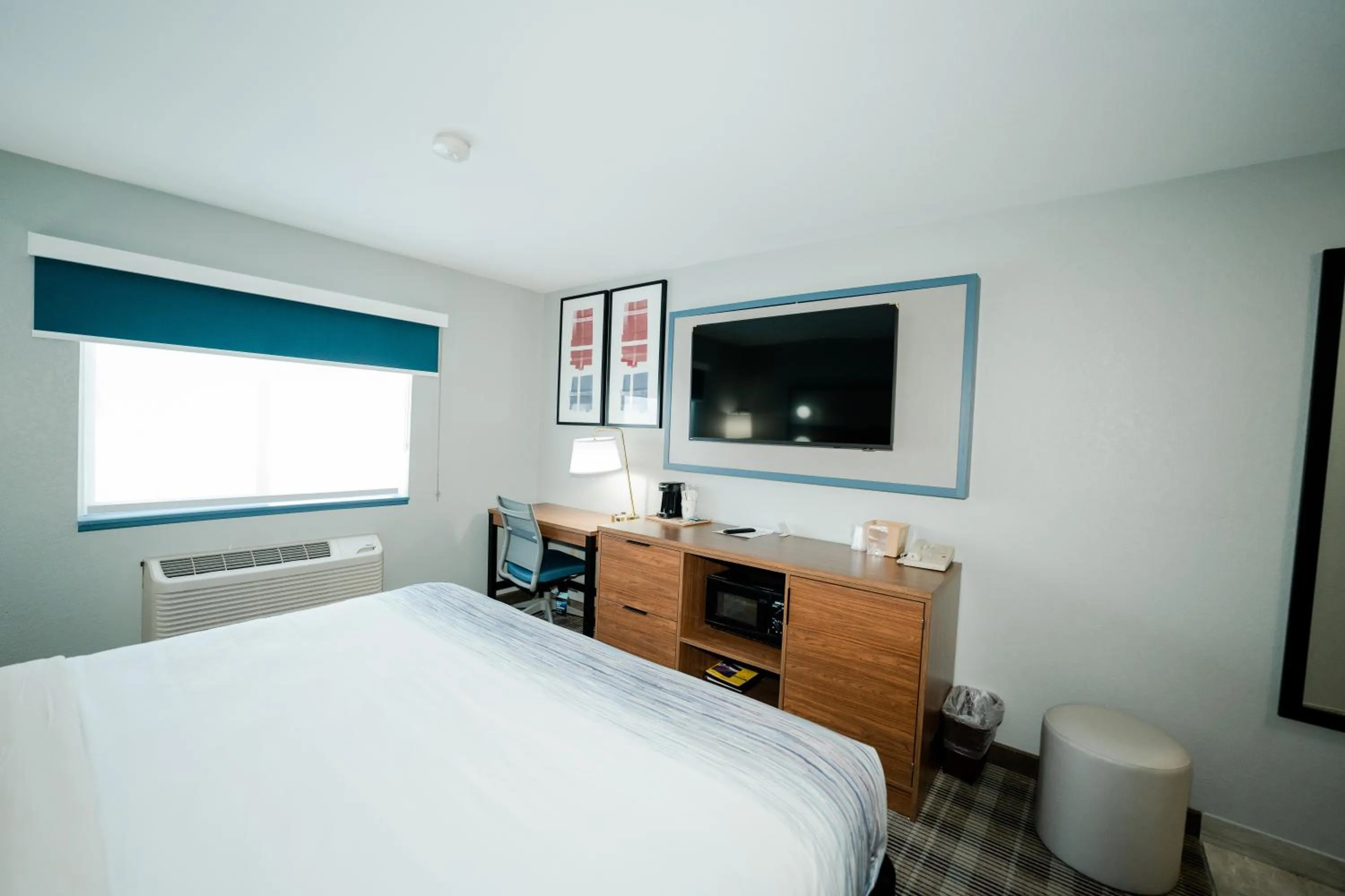 Bed in AmericInn by Wyndham Tomahawk