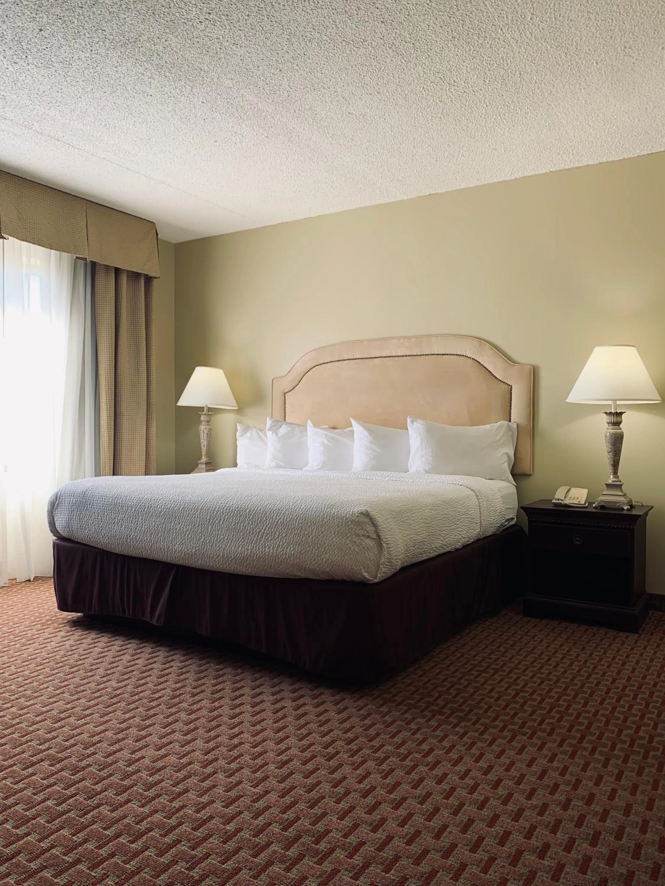 Bed in Euro-Suites Hotel