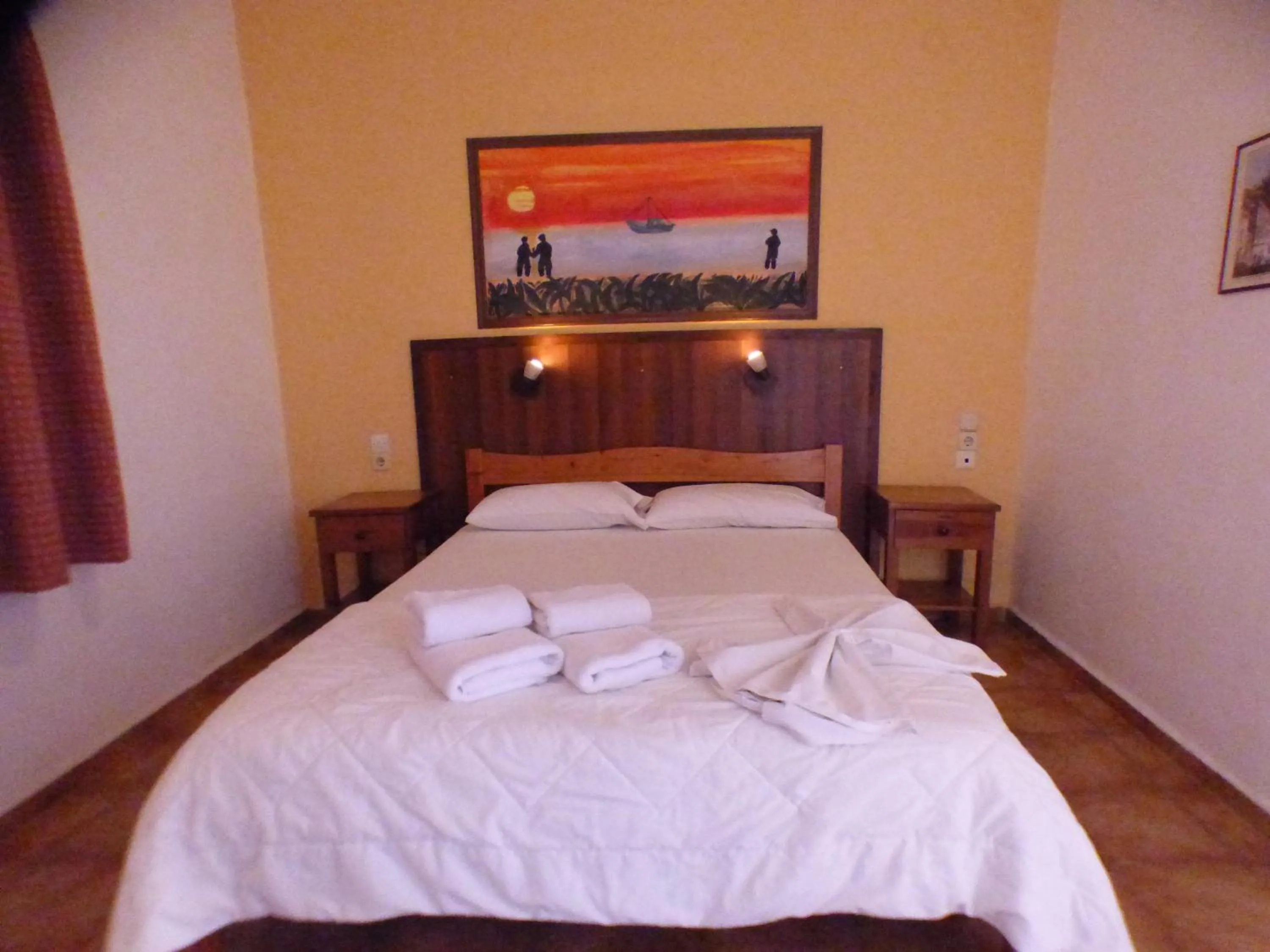 Bed in Eleni Apartments