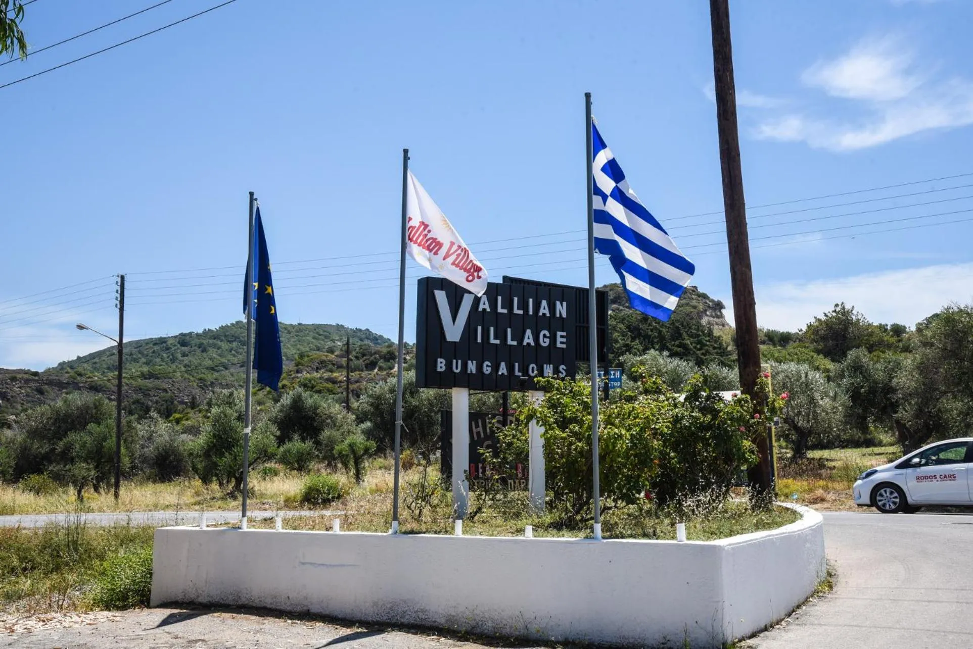 Property logo or sign in Vallian Village Hotel