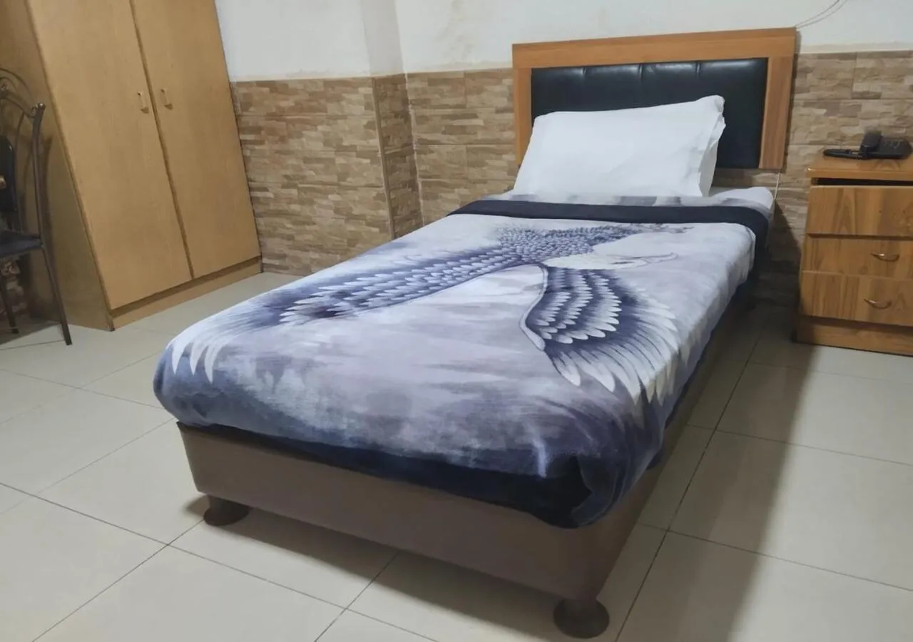 Bed in Amman Palace Hotel