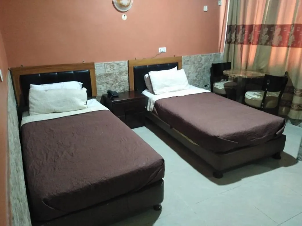 Bed in Amman Palace Hotel