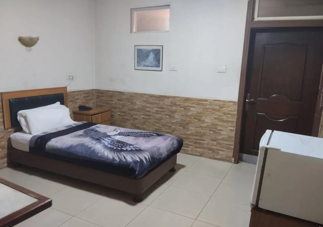 Bed in Amman Palace Hotel