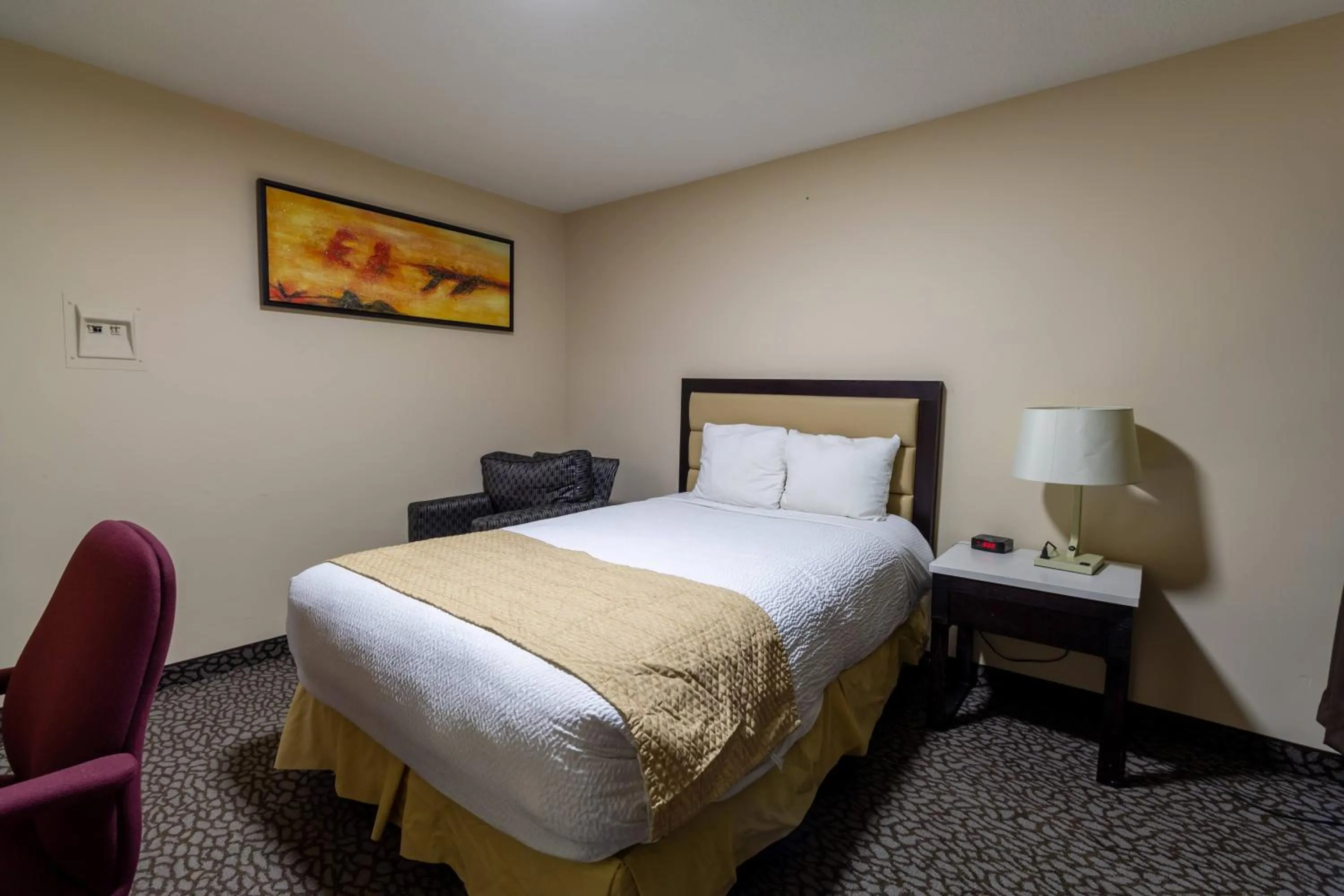 Bed in North Star Inn & Suites