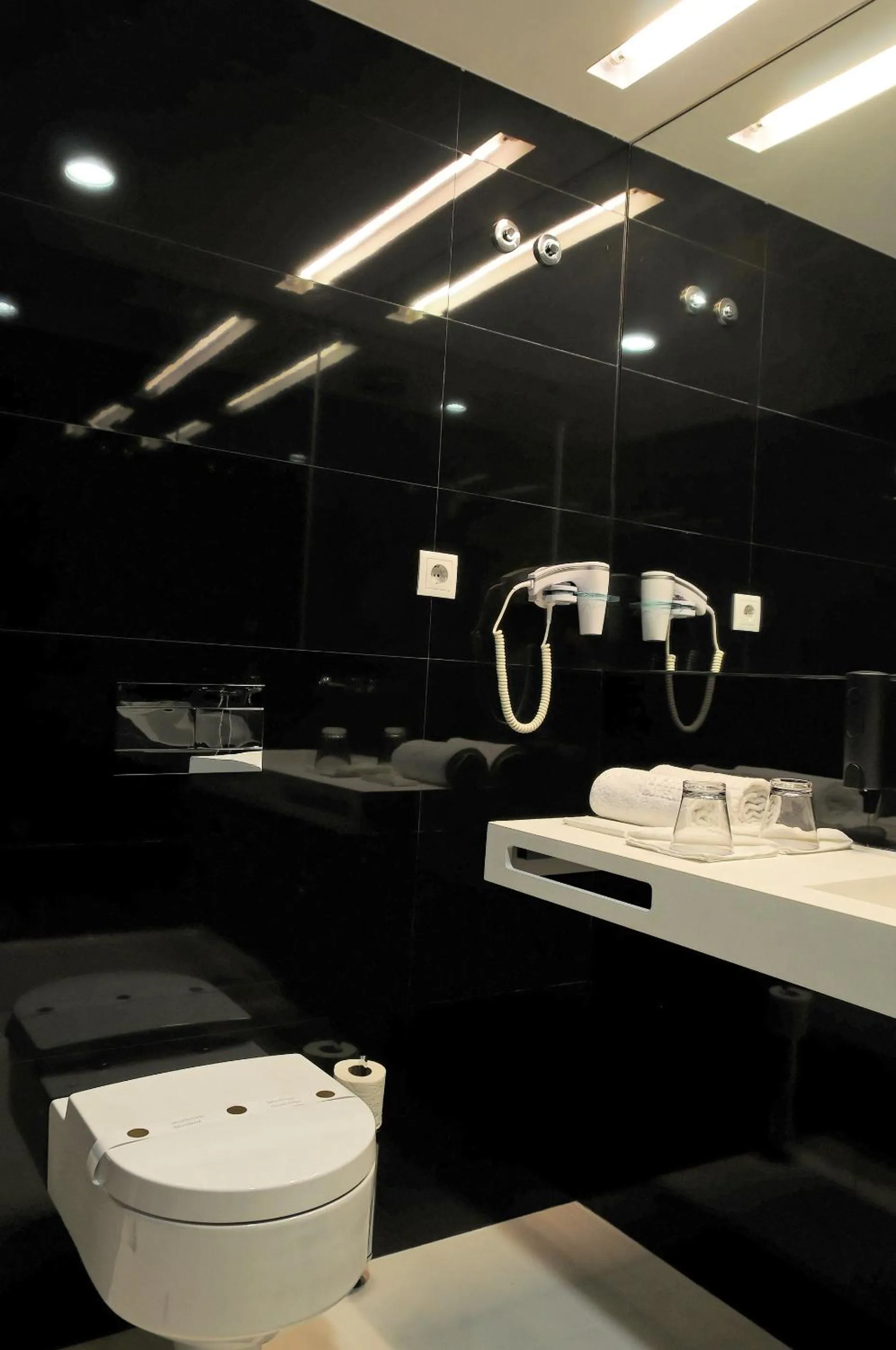 Toilet in Open Village Sports Hotel & Spa Club